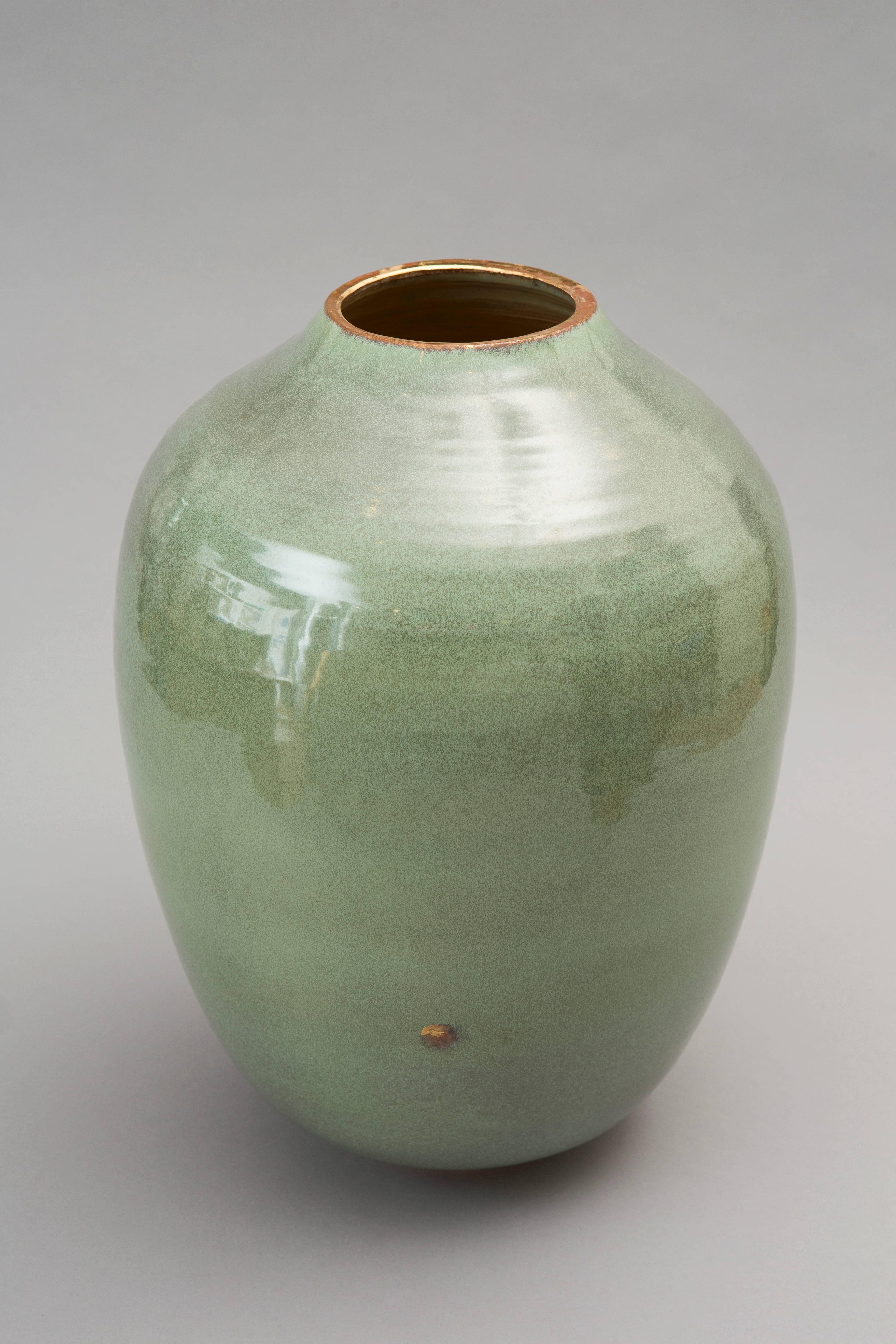 Wheel thrown green celadon vase stoneware. 
Glazed and gilded. 
One of a kind signed on the bottom. 
