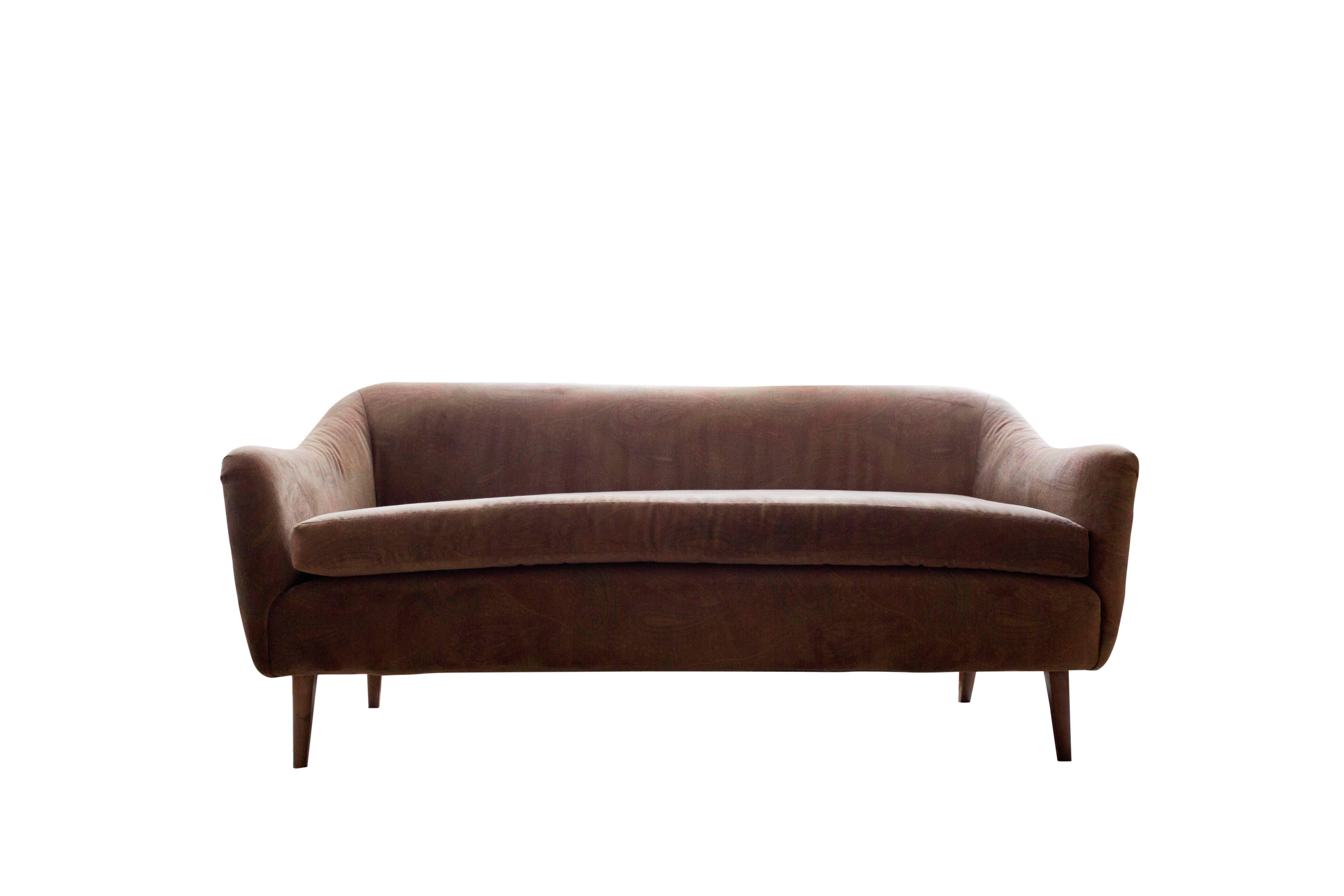 Recently upholstered in a brown paisley velvet fabric, this small sofa/loveseat/settee has wonderful curvaceous lines and very comfortable to sit for long hours.