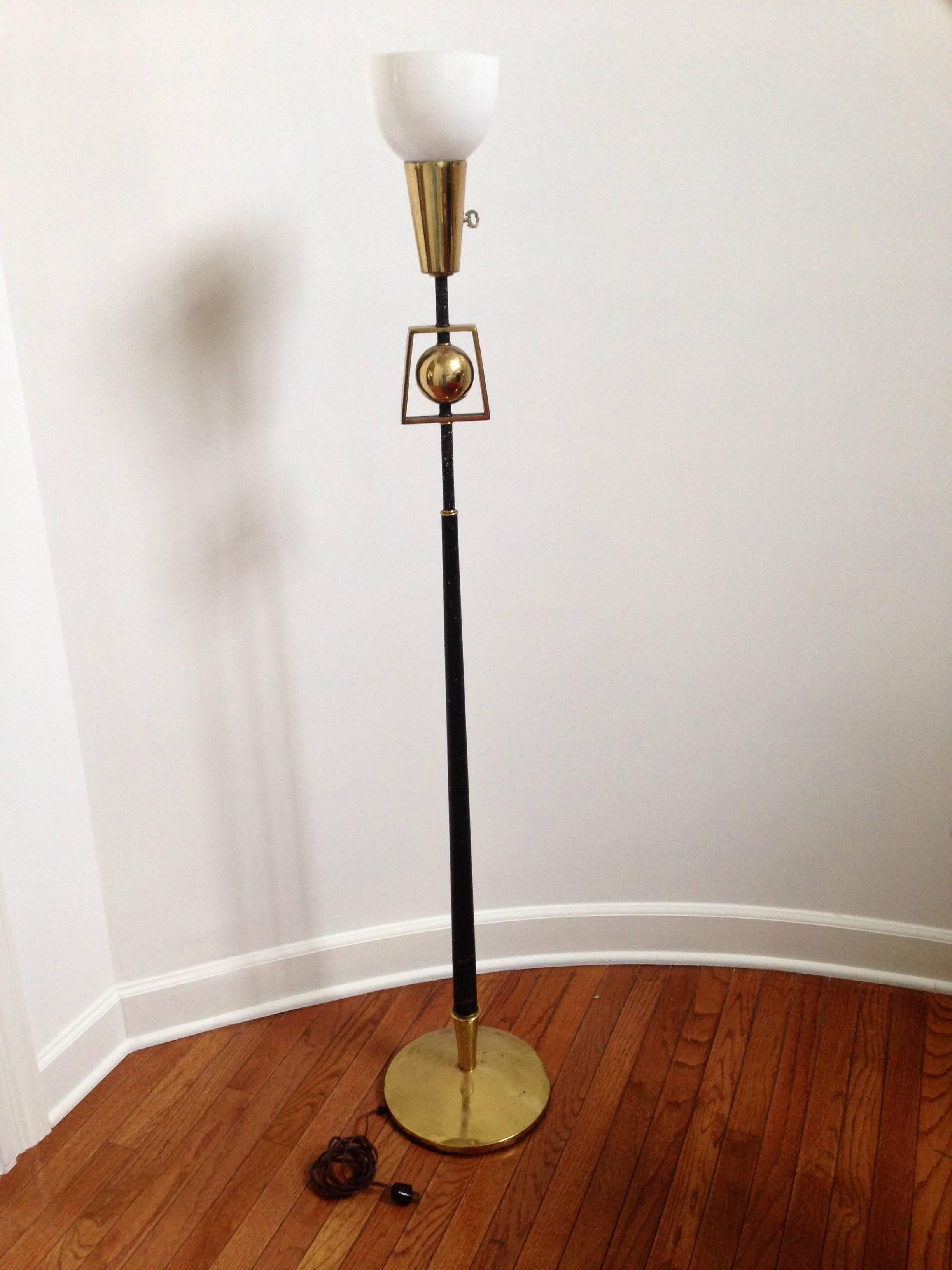 Fabulous modern standing lamp with brass details including base. Very much in vogue, the contrast of black and brass is very attractive. 

Note: The fabric shade is not included and the glass bowl shade which is included is secured with a bulb