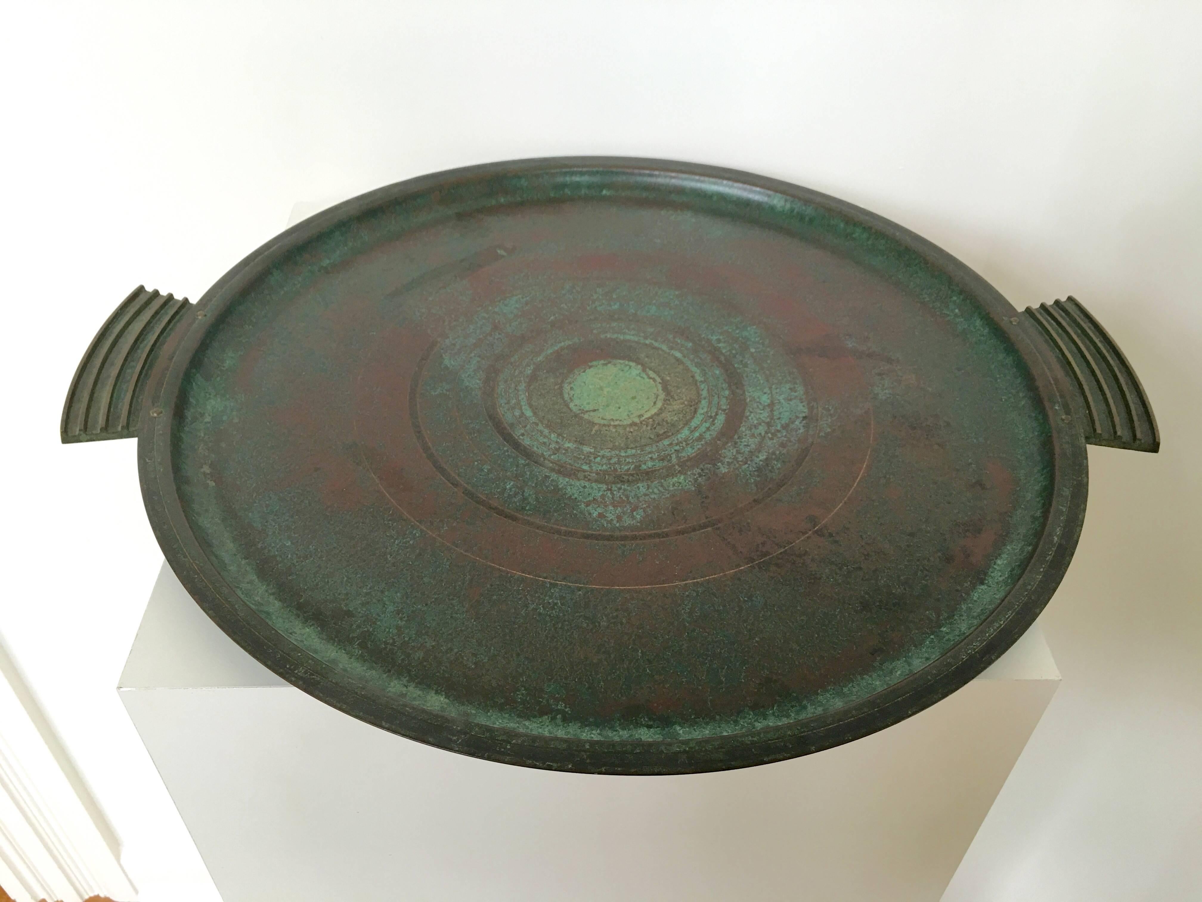 A rare and sizable bronze tray by Carl Sorensen, signed. Perfectly reflective of the Arts & Crafts period with hand tooled details. The verdigris patina is gorgeous.