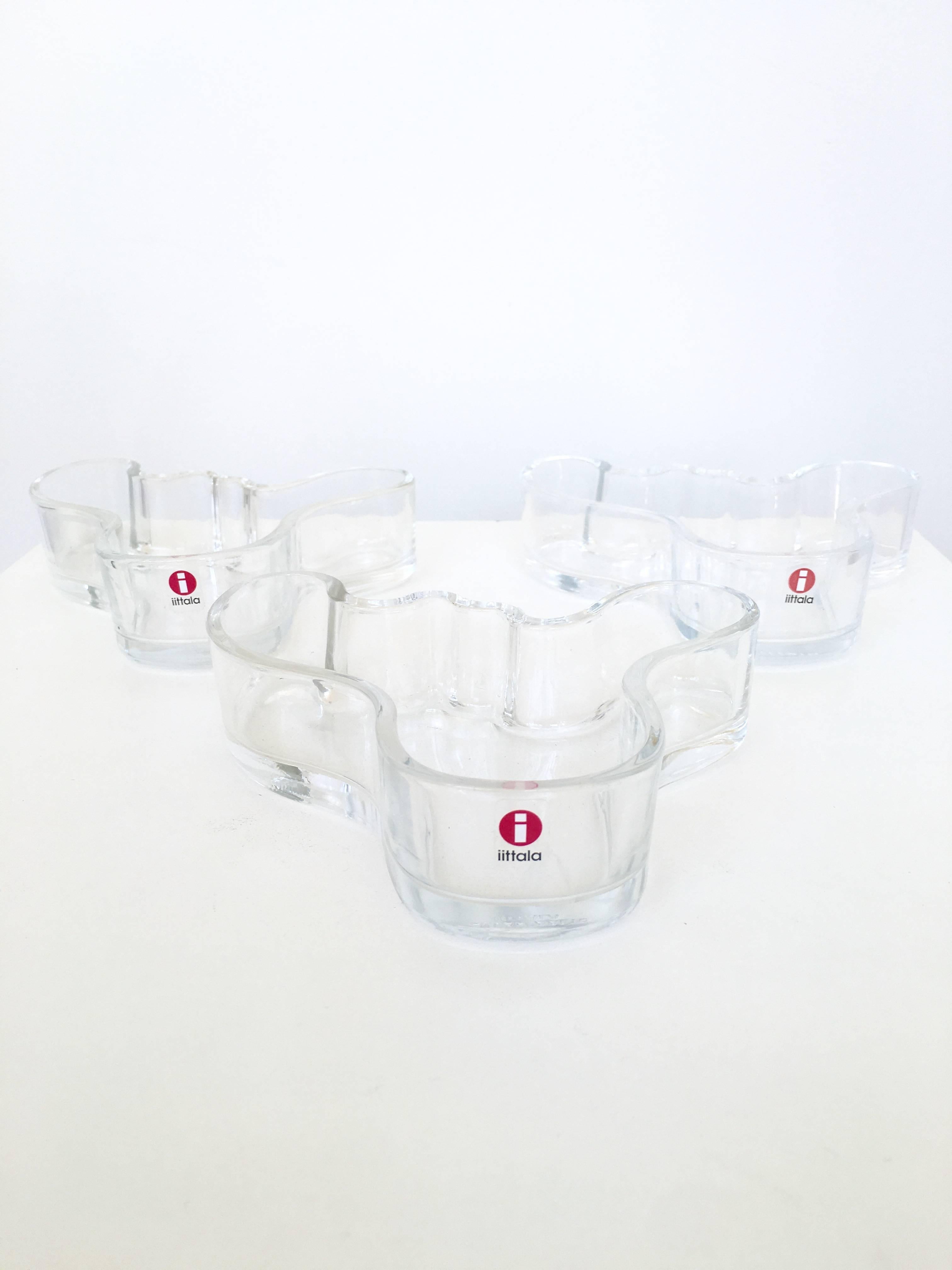 The candy dish or tray version of the iconic Alvar Alto glass vase by Ittala, Italy. Perfectly formed amoebic shape which is very sculptural especially when all three are grouped together. Great for serving nuts and candies.