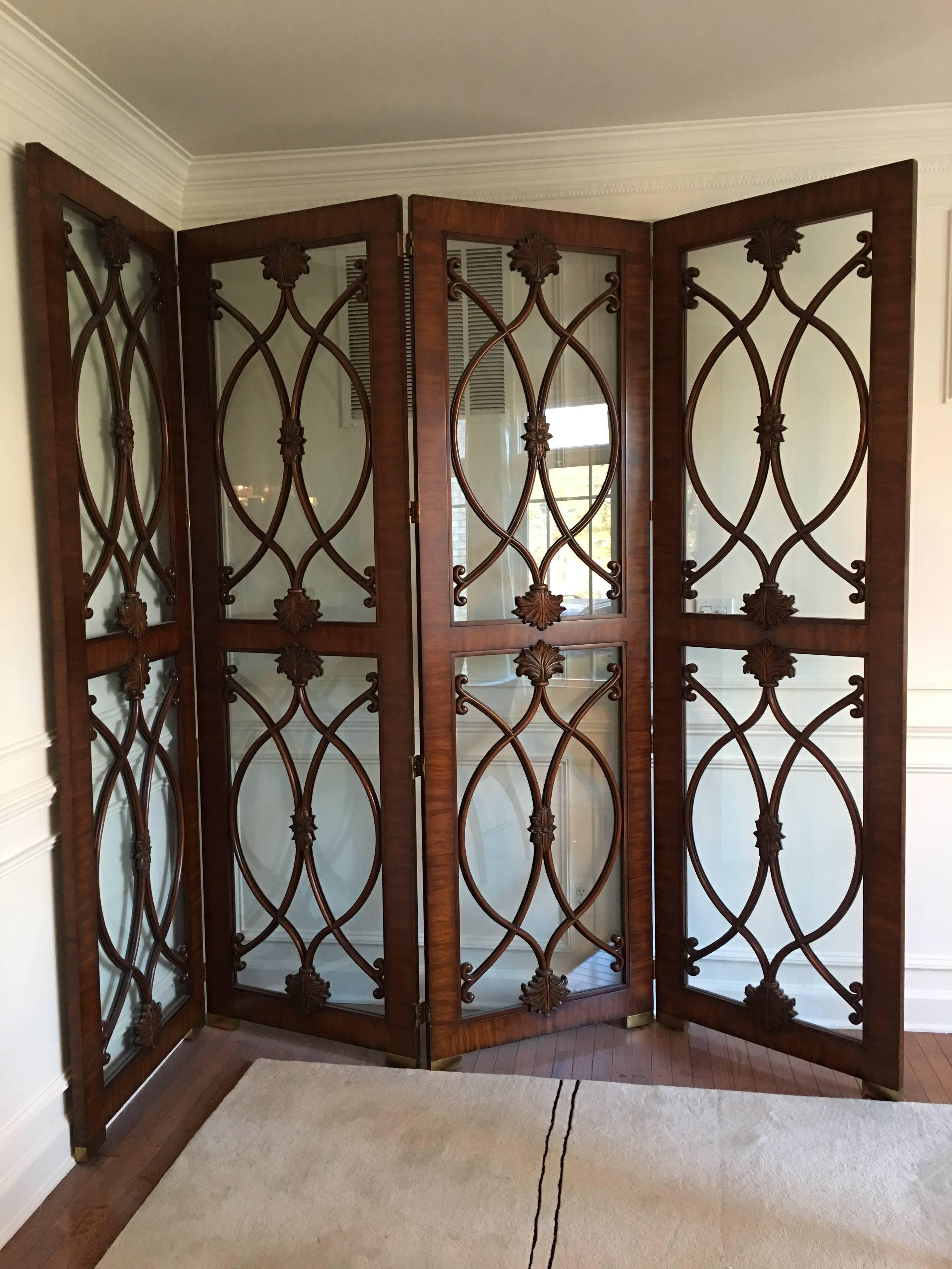 An exceptionally crafted, large screen with four glass panels encased in a Palisander wood frame with bronze feet and an overlaid bentwood that is believed to be Mahogany. The bentwood and carved detail is superb. A stunning, monumental and