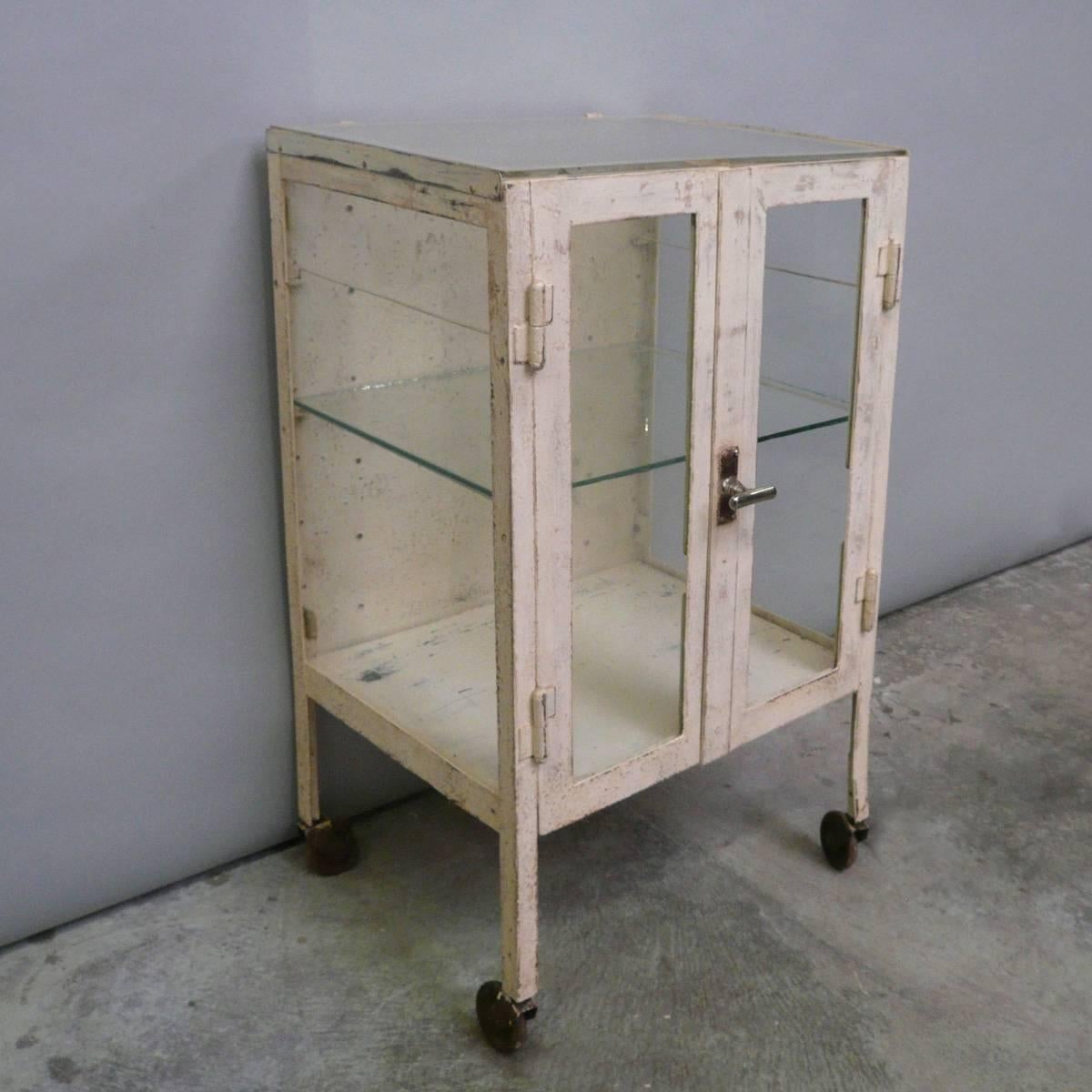 Hospital trolley from the 1940s. The trolley is made from thick steel and glass.