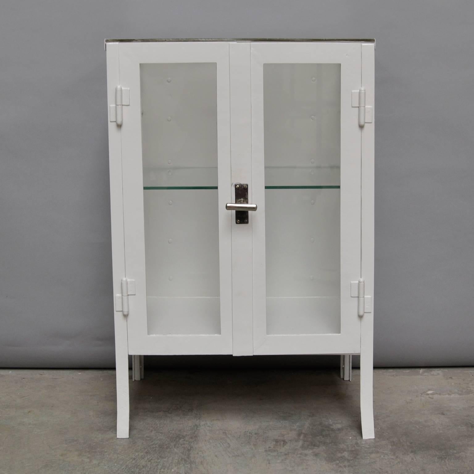 Hospital cabinet from the 1940s, produced in Hungary. The cabinet is made from steel and antique glass.
The cabinet is restored.