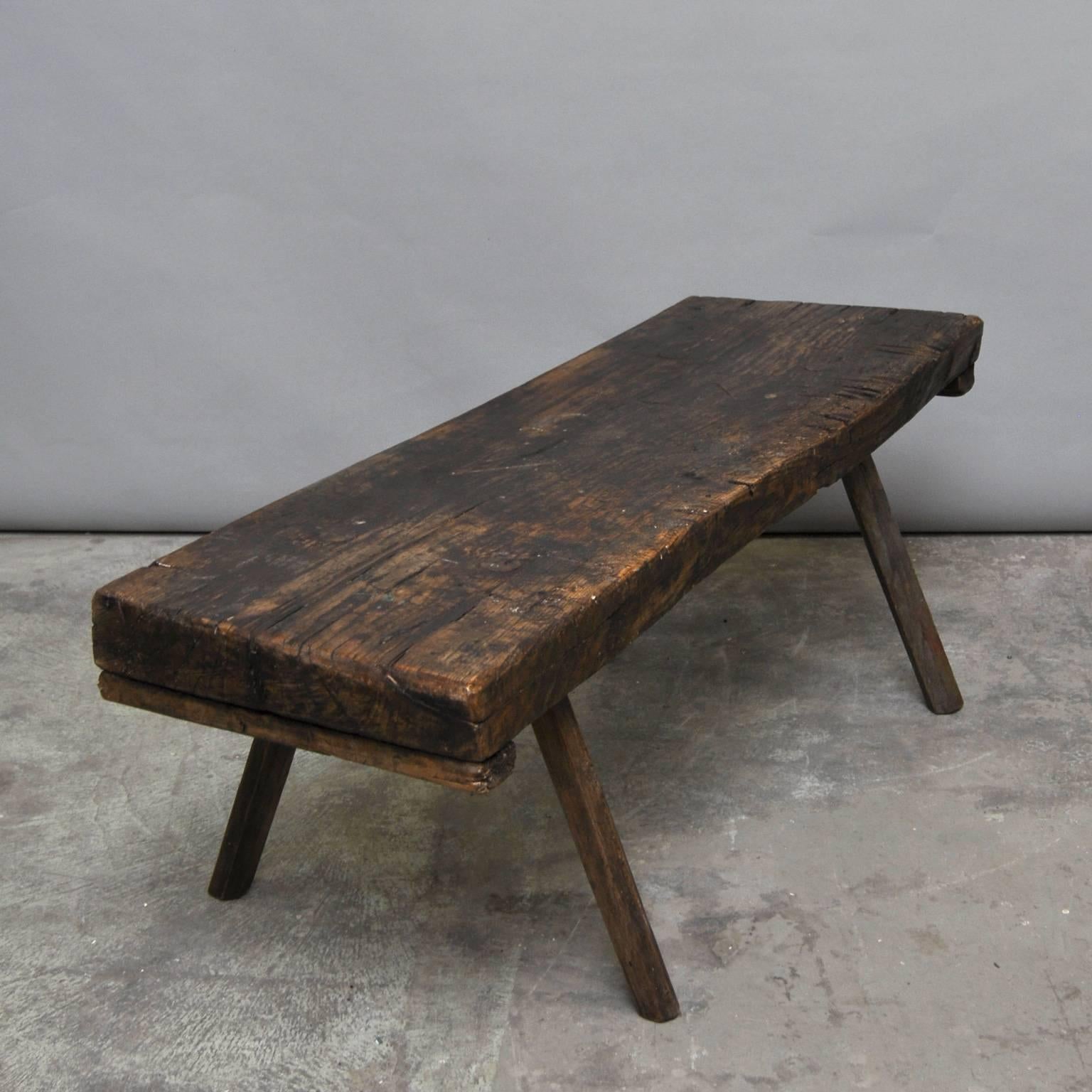 This oak butcher's block with a 8 cm thick top was produced in Hungary around the 1920s. The piece features its original oak legs, and has been wax-finished. The block has been cut down to a standard coffee table size.