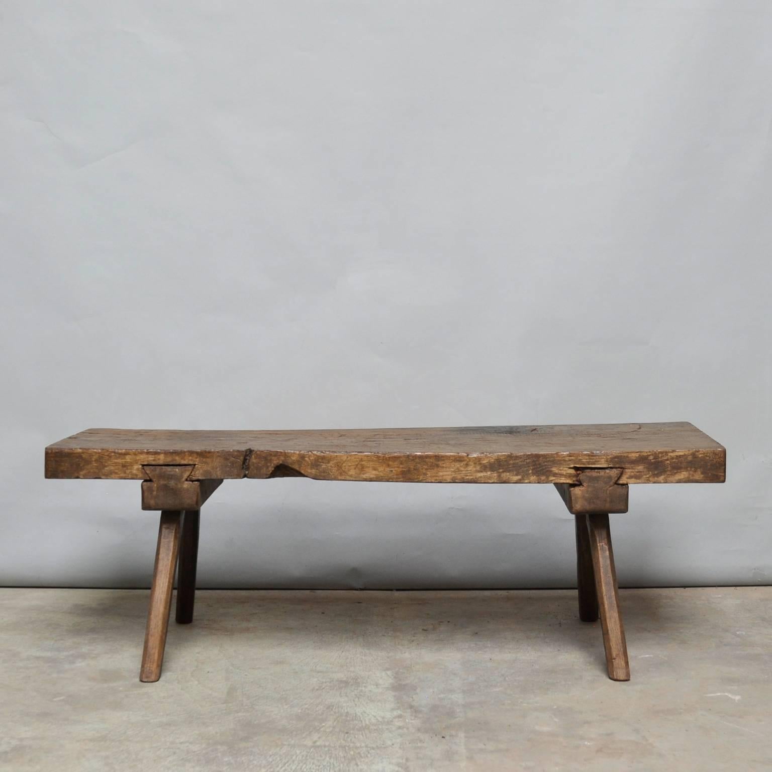 This oak butcher's block with a 10 cm thick top was produced in Hungary around the 1930s. The piece features the original oak legs, and has been wax-finished. The block has been cut down to a standard coffee table/bench size.