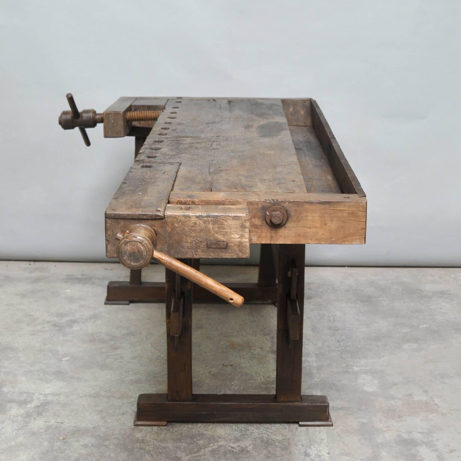 This vintage Hungarian carpenter’s´ workbench features two vices and a recessed tray where the carpenter would lay his tools. It was manufactured, circa 1935.