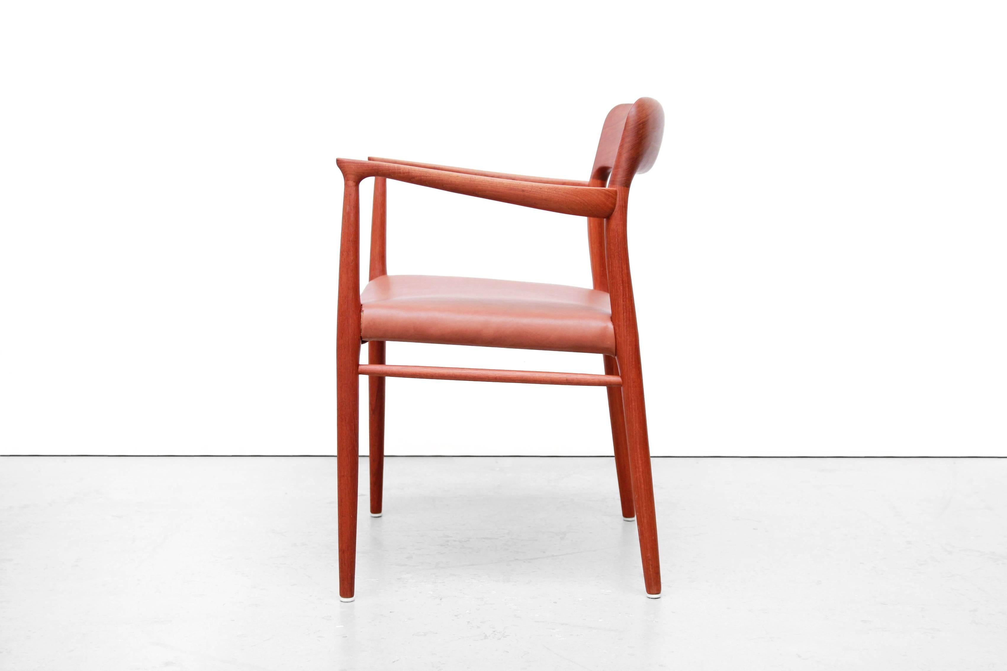 Beautiful high armchair or comfortable dining chair with armrests designed by Niels Møller. Niels Møller is known in Denmark for quality and craftsmanship and is also well-liked in this model, model 56. According to the first owner of this chair,