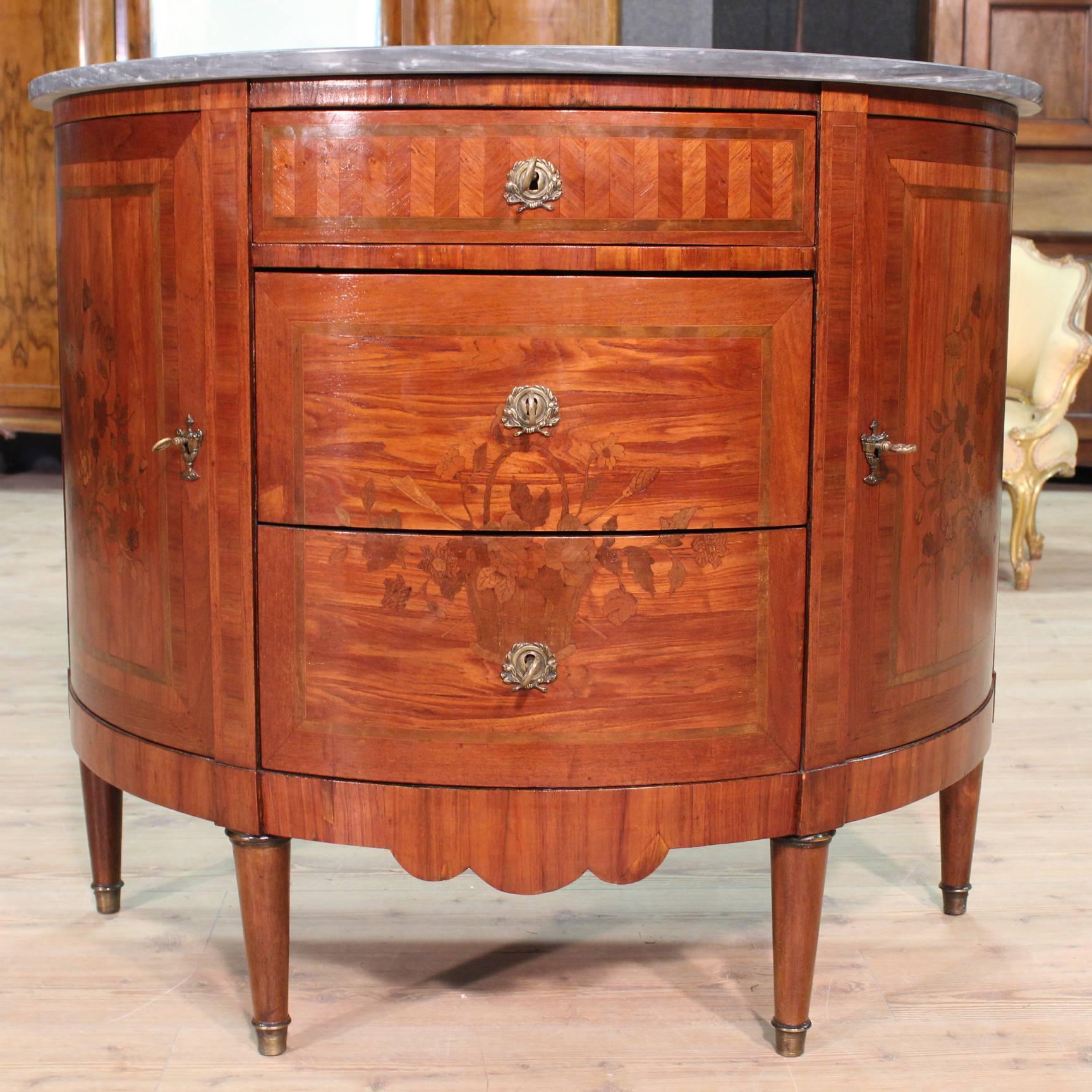 Nice demilune chest of drawers or sideboard, France, 19th century. Furniture carved and inlaid in rosewood, toulipier, cherry, walnut and alder of fine line. Furniture with three drawers and two doors of good proportions and good service, complete
