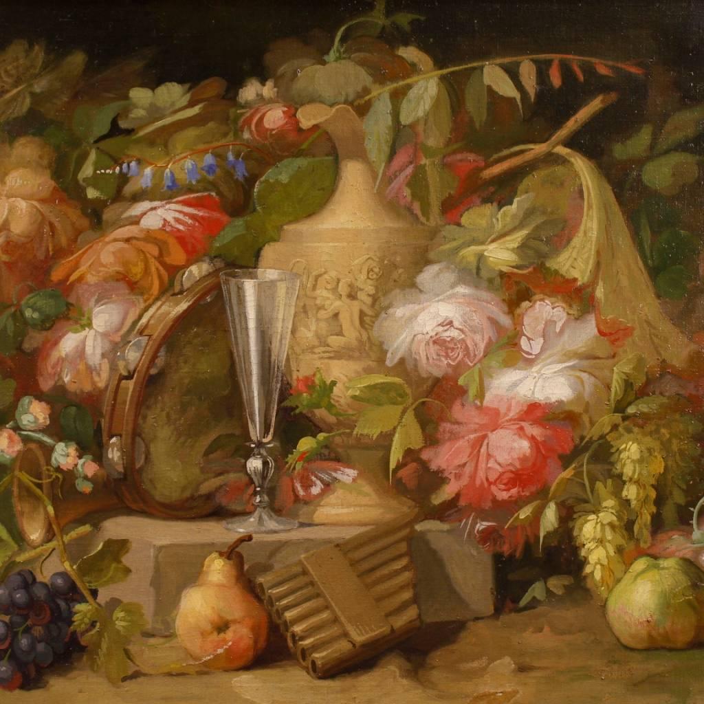 French painting of the second half of the 19th century. Work oil on canvas depicting elegant still life with flowers, fruits, decorative tools and decorative elements of excellent pictorial quality, 20th century frame of wood and plaster, richly