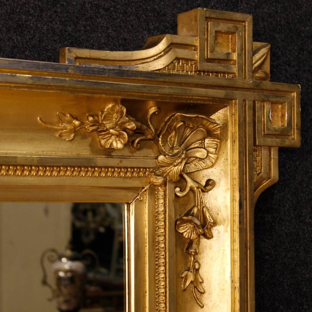 Antique French mirror of the second half of the 19th century. Furniture in richly carved and golden wood and plaster. Highly proportion mirror that can be easily inserted at different points in the house. Furniture that can be positioned