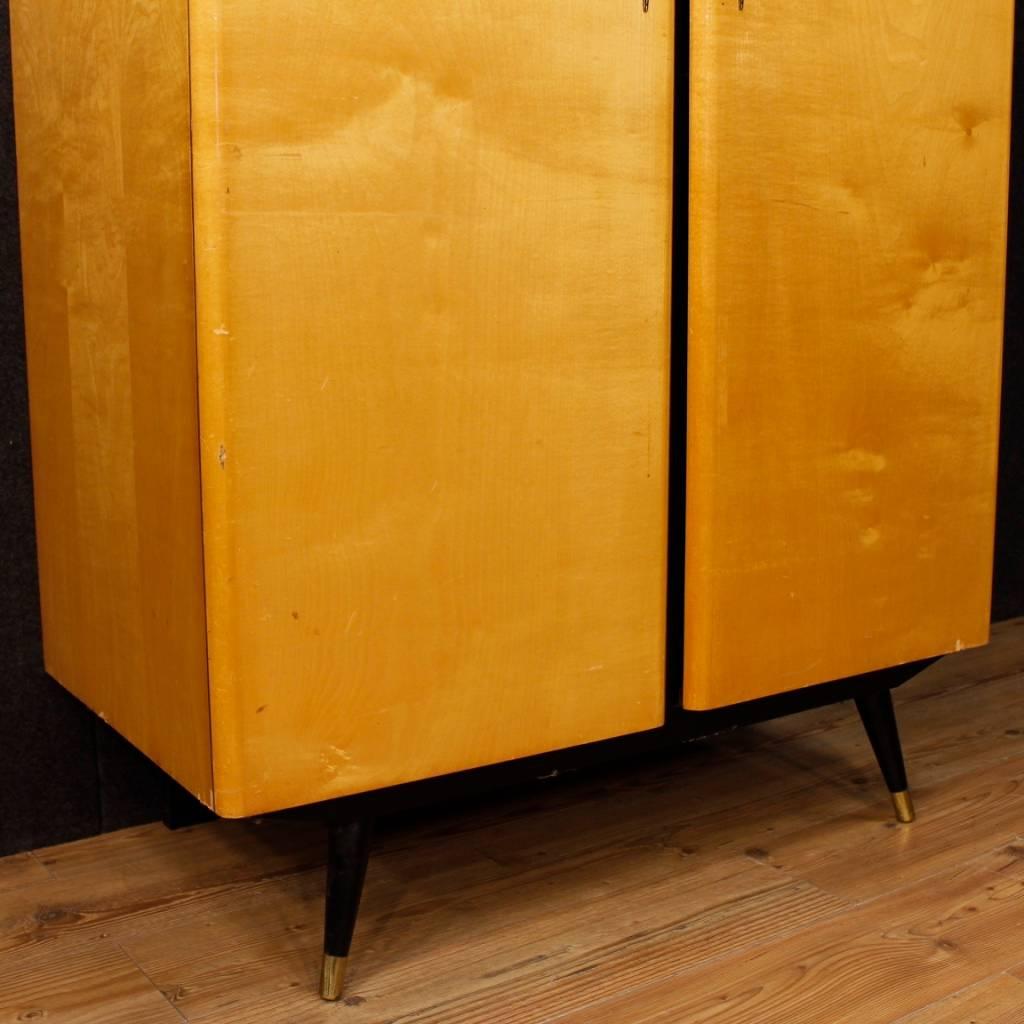 French wardrobe of the 20th century. Design furniture in wood of beautiful line and construction. Armoire with two doors, of great capacity and service. Furniture complete with three internal shelves on the right side and hanger bar on the left