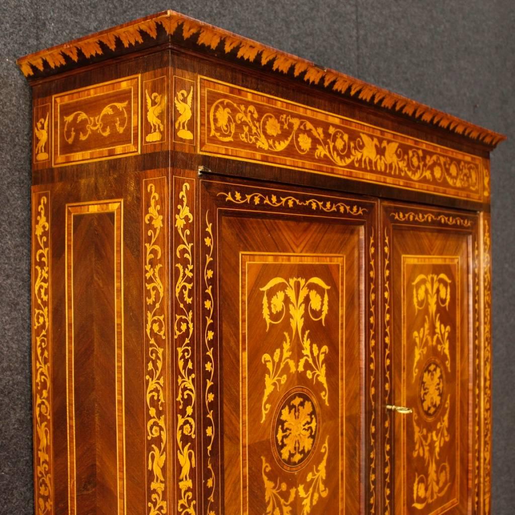 Italian trumeau of the 20th century. Furniture richly inlaid in various precious woods, rosewood, walnut, maple, boxwood and fruitwood. Furniture in Louis XVI style, double body trumeau ideal to be inserted in a living room or studio. Lower body