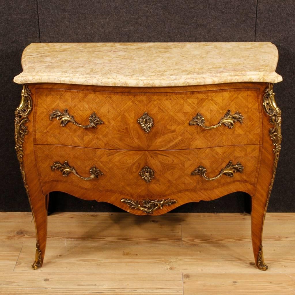 French dresser from the mid-20th century. Furniture richly decorated with bronzes and geometric inlay in rosewood in Louis XV style. Commode with two drawers, of good capacity and service, ideal to be placed in a bedroom or living room. Chest of