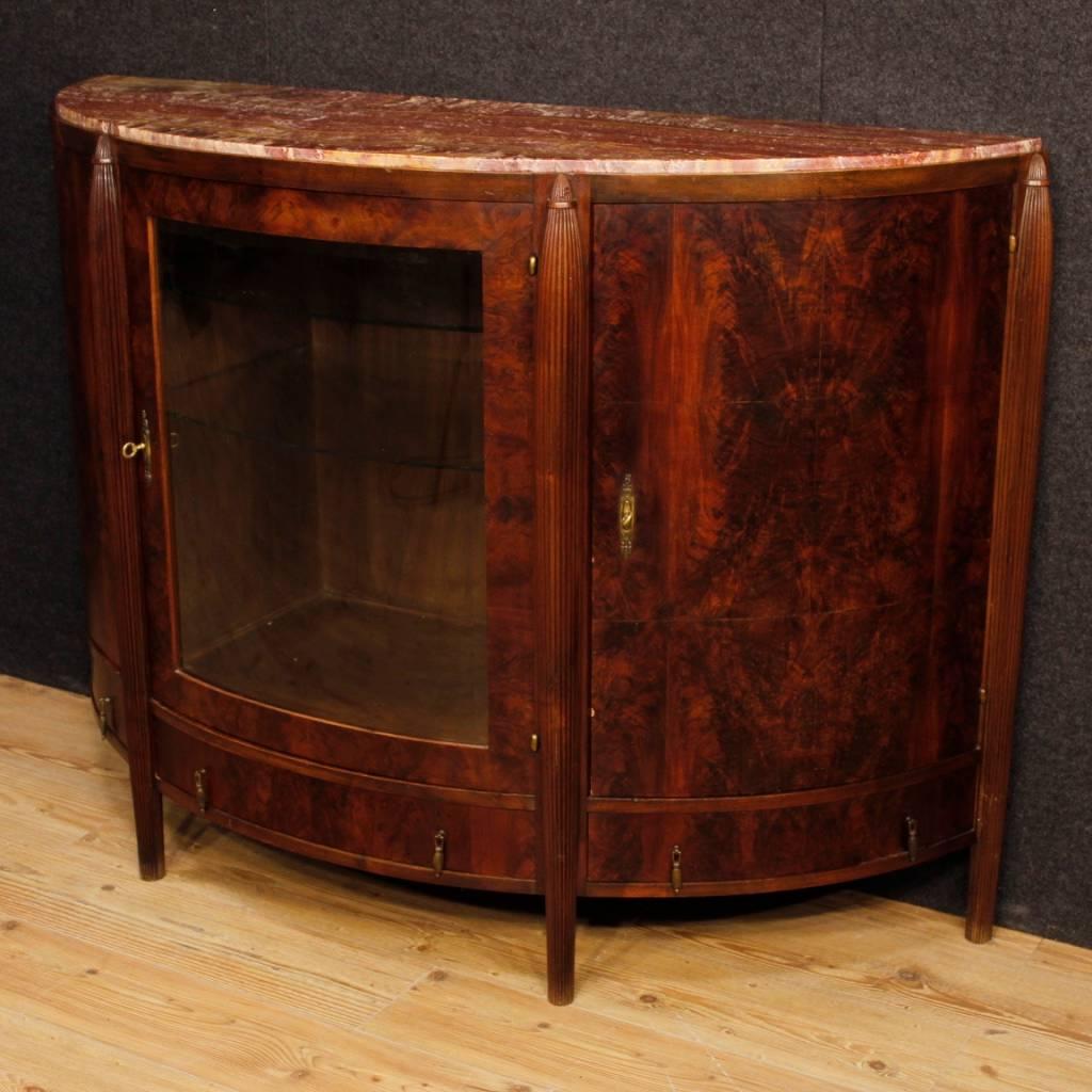 Dutch sideboard from the first half of the 20th century. Art Deco furniture in mahogany of excellent quality. Sideboard with three doors and three drawers of excellent capacity and service. Top in marble of great measure, restored during the 20th