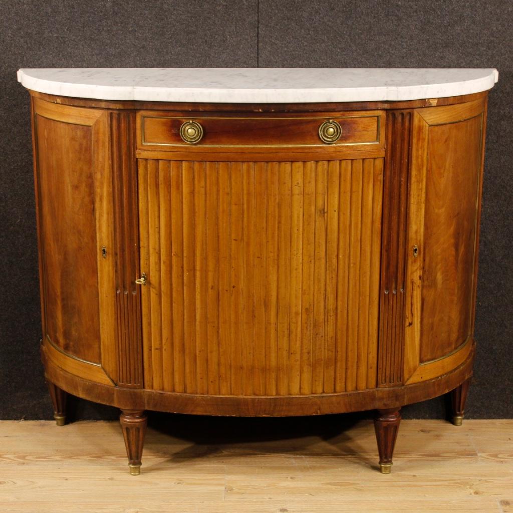 French sideboard from the mid-20th century. Furniture of beautiful decor, in Louis XVI style, carved in mahogany wood. Sideboard with three doors and a drawer of good capacity and service. Top in original marble in perfect condition. Ideal sideboard