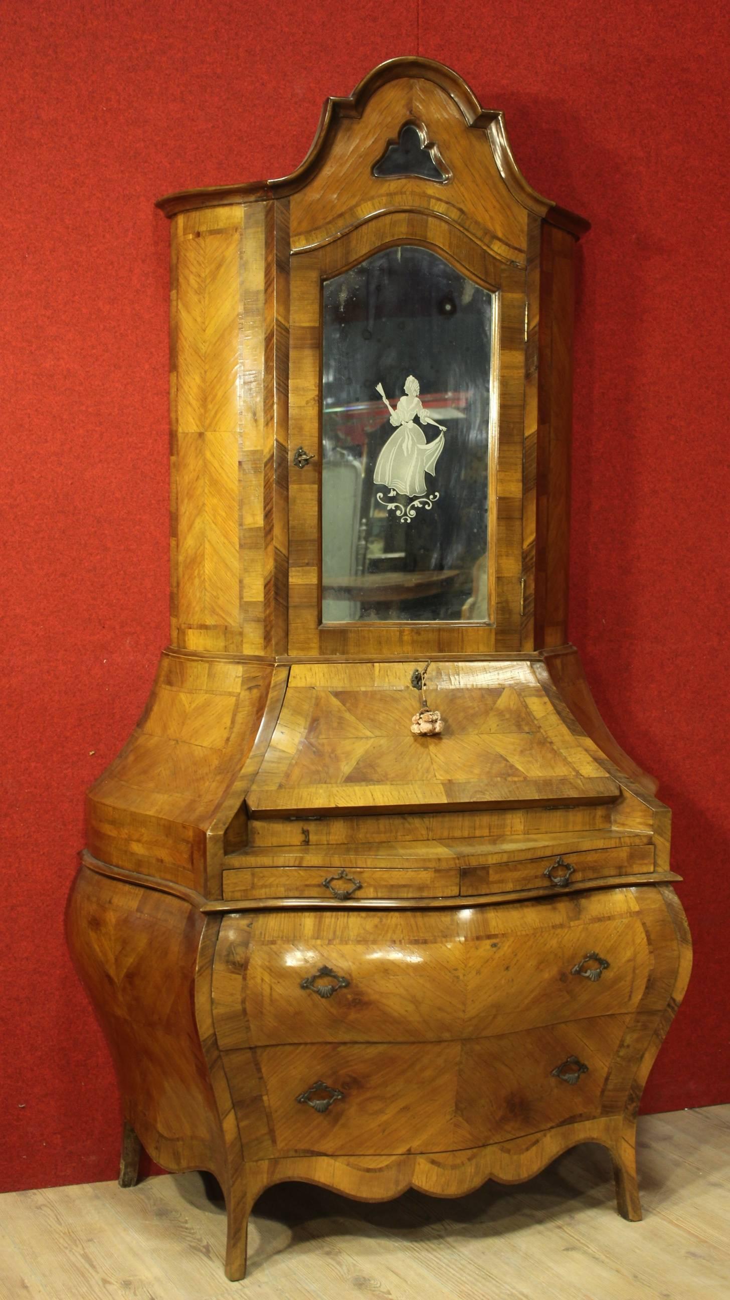 Double bodied Venetian bureau. It is made from walnut and burl walnut. Upper half features three shelves, two recessed mirrors, one inlaid with a female figure in eighteenth century dress. Curved lower half with four external drawers and four