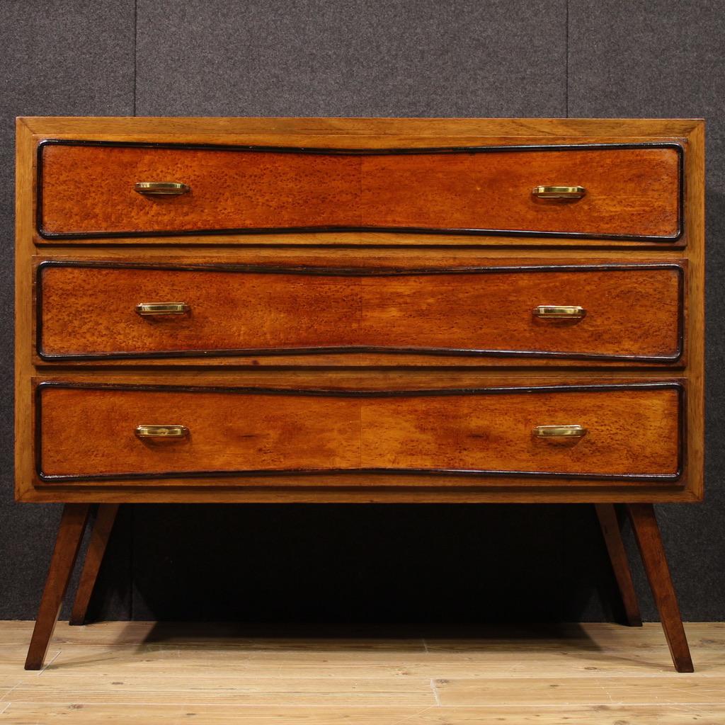 Italian design chest of drawers from the 70s. Fabulously lined furniture veneered in thuja root with ebonized wood drawer borders. Chest of drawers equipped with three capacious drawers adorned with original gilded brass handles (see photo). Wooden