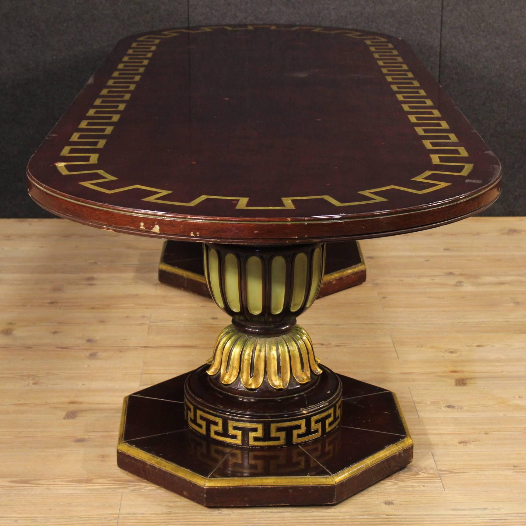 Great Spanish table of the mid-20th century. Furniture made by ornately carved, lacquered, gilded and painted wood of beautiful decoration. Table of great size and exceptional service ideal to be included in a salon. Furniture consists of two wooden
