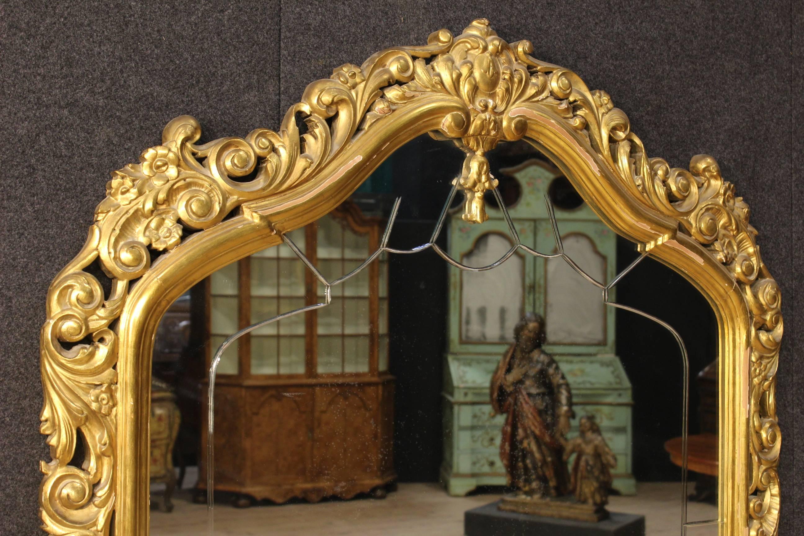 Big French console table with mirror of the 20th century. Furniture made by ornately carved, gilded and painted wood of beautiful decoration. Furniture built in two separated bodies for an easier transport and moving (console + mirror). Console with
