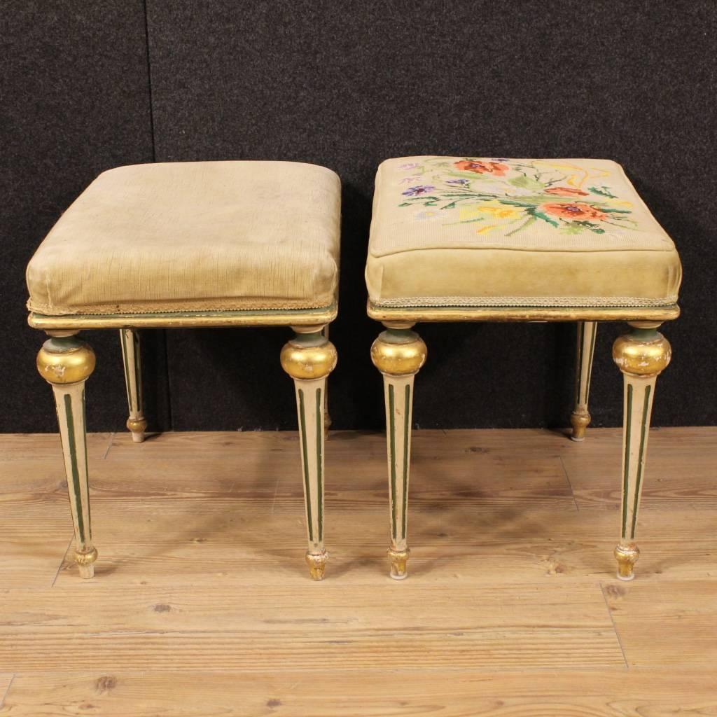 Beautiful pair of Italian footstools of the mid-20th century. Furniture in nicely carved, painted and gilded wood of beautiful line and good taste. Seat upholstered in fabric with different signs of wear, to be replaced. Footstools which are part of