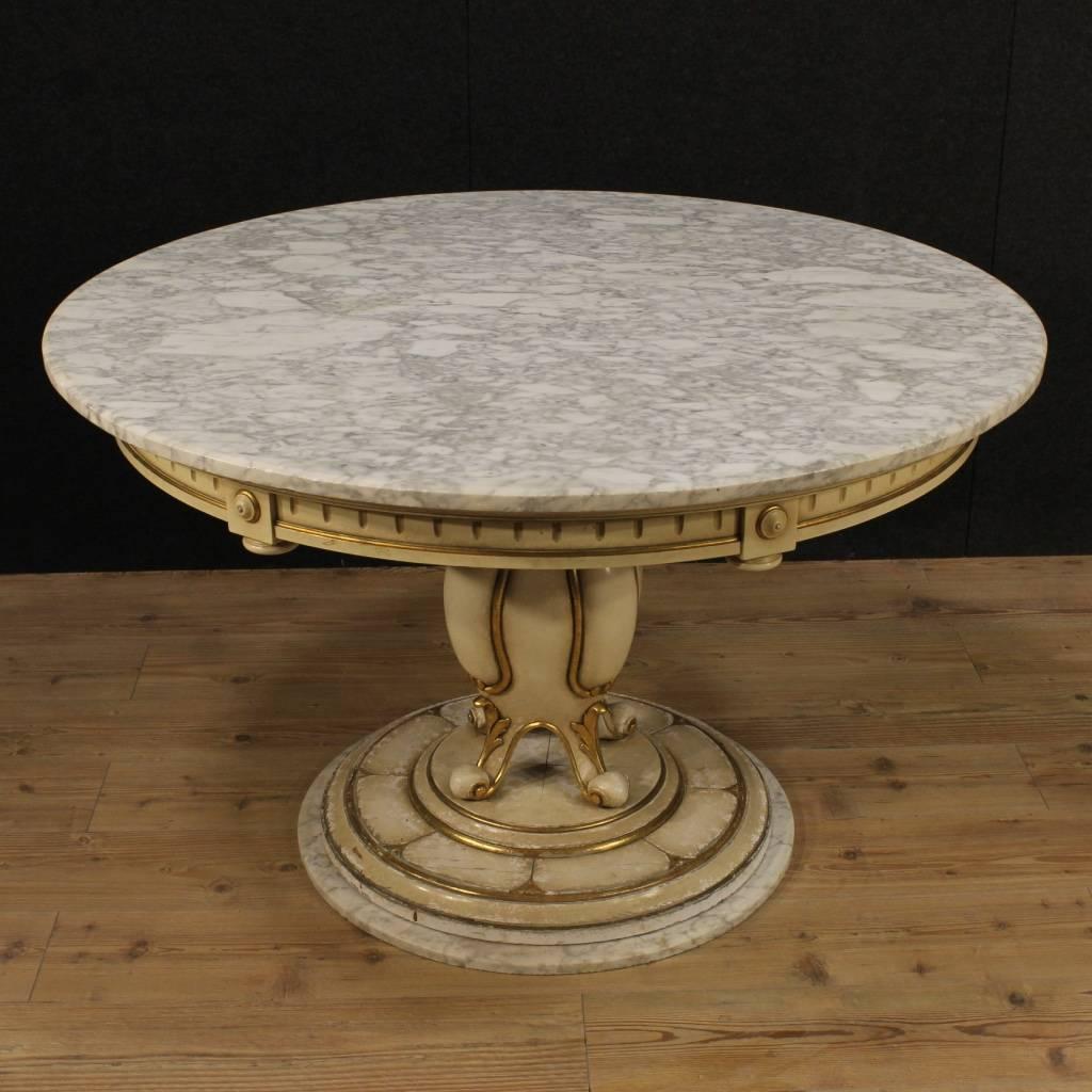 Great French table of the mid-20th century. Furniture in ornately carved, lacquered and gilded wood, of great taste and enjoyment. Table of special construction with base and top in marble in perfect condition. Top of great size and service,