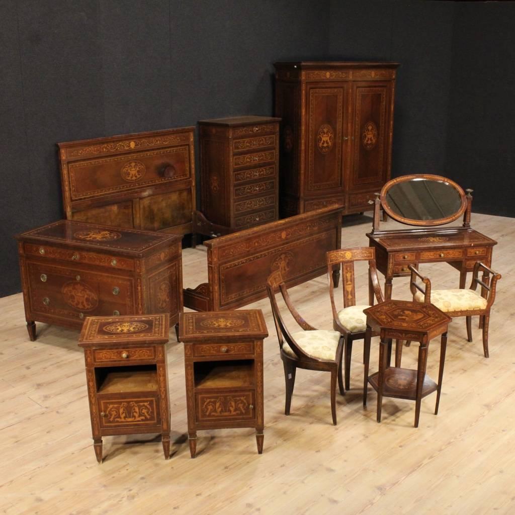 Elegant Italian wardrobe of the mid-20th century. Furniture richly inlaid in palisander, rosewood, walnut, mahogany, maple and fruitwood, of high-impact and quality. Wardrobe with two doors and two external drawers, of large capacity and service,