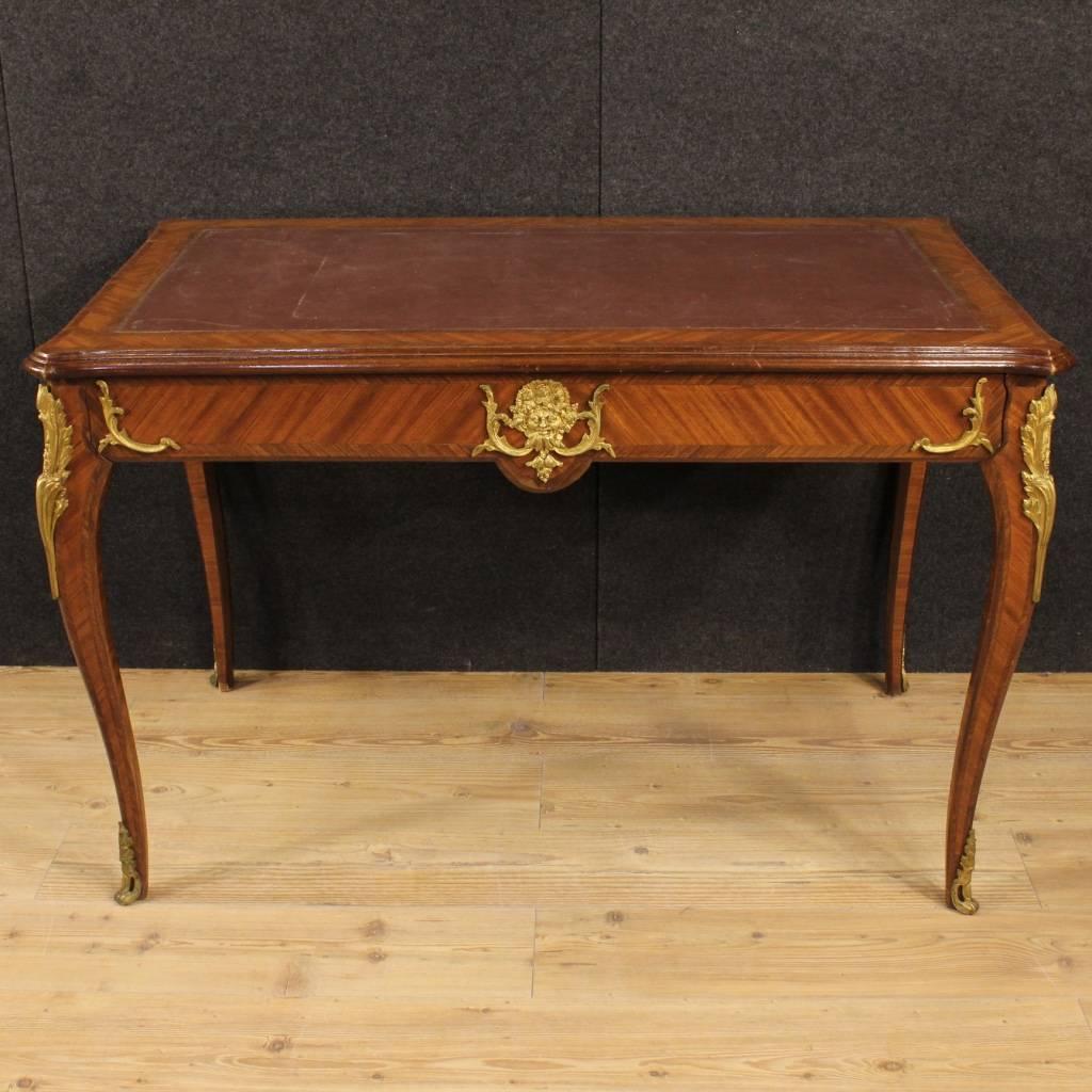 Stylish French writing desk of the mid-19th century. Furniture in rosewood with solid wood borders decorated with gilt and chiseled bronzes. Desk finished for the center equipped with a frontal drawer, of good ability. Top in faux leather with some