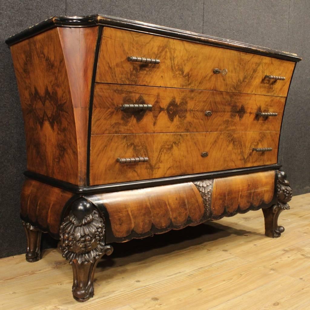 Rare Italian dresser of the first half of the 20th century. Furniture in Art Deco style richly carved in walnut, burl and ebonized wood. Original marble top in perfect condition, of great size and service. Dresser provided with four drawers, of