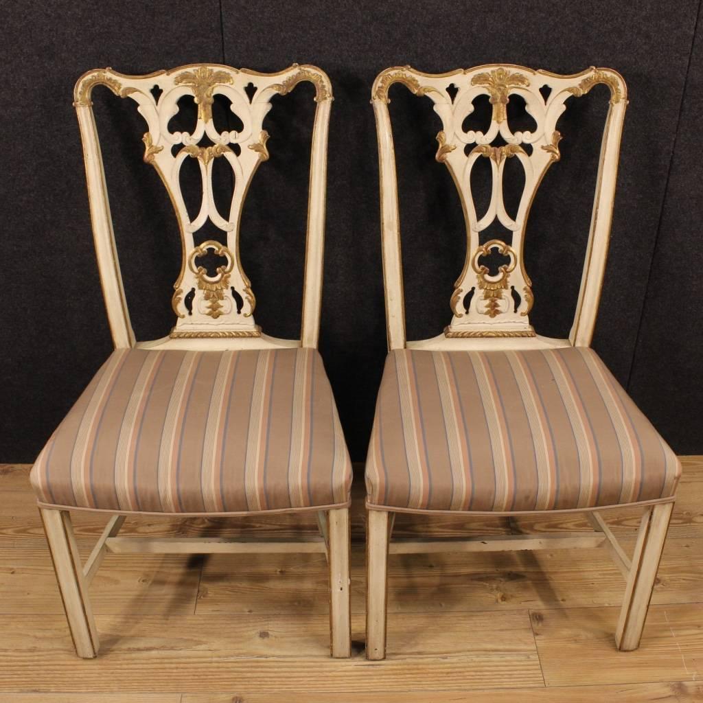 Pair of Italian chairs of the 20th century. Furniture in carved, lacquered and gold wood of beautiful decoration. Chairs upholstered in fabric with different signs of wear, to be replaced. Furniture that can be easily inserted at different points of