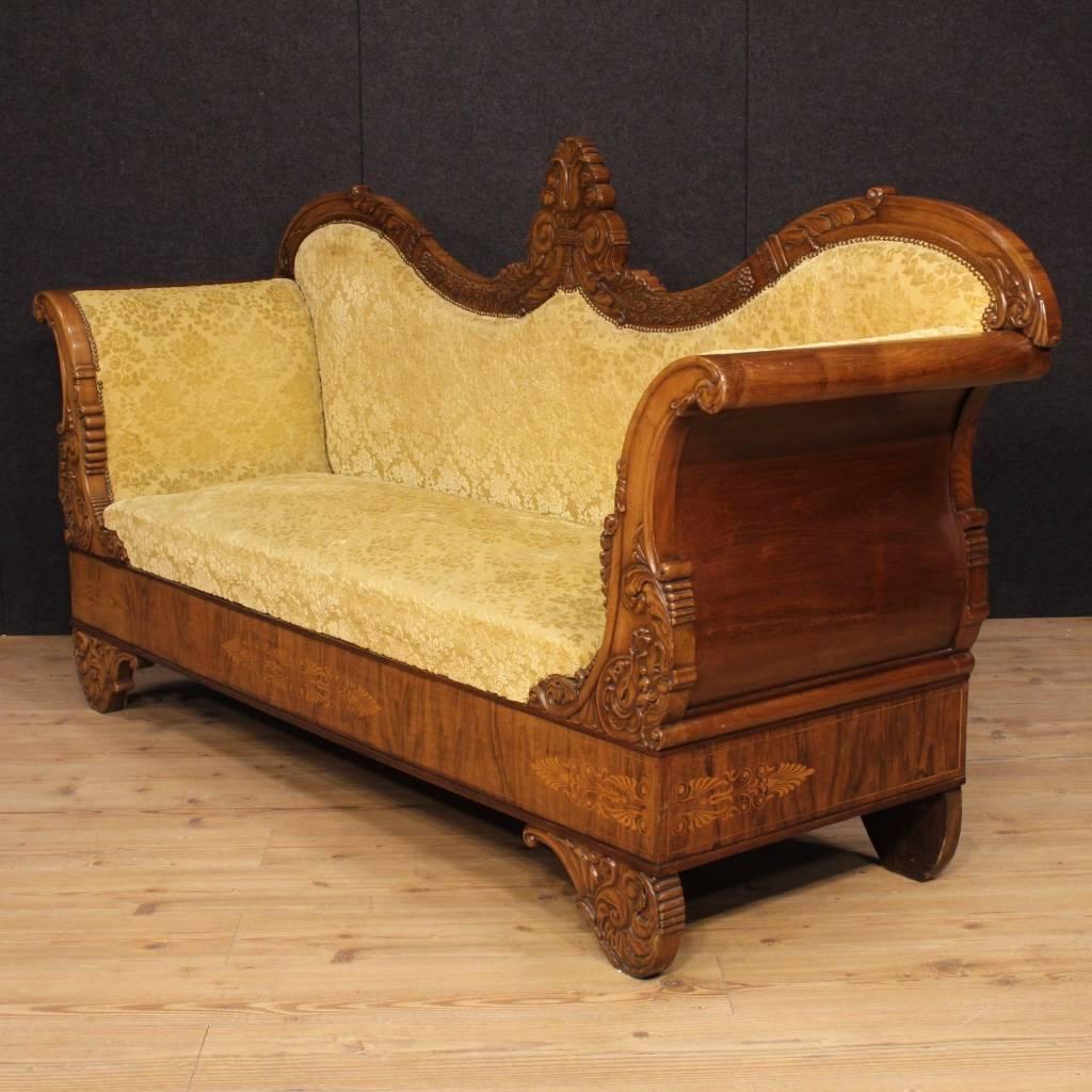 Great French sofa from the second half of the 19th century. Canapé richly carved and inlaid in walnut and maple of high-quality. Antique three-seat sofa, padding in good condition. Furniture upholstered in yellow damask velvet that has some signs of