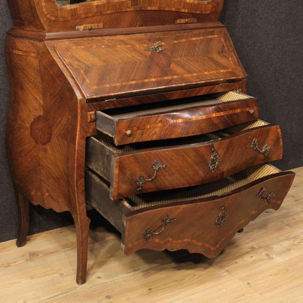 Elegant Genoese trumeau of the first half of the 20th century. Double body furniture of high-quality in kingwood, rosewood and burl. Lower body with bureau having three external drawers of good capacity. Inside of the fall-front complete with five