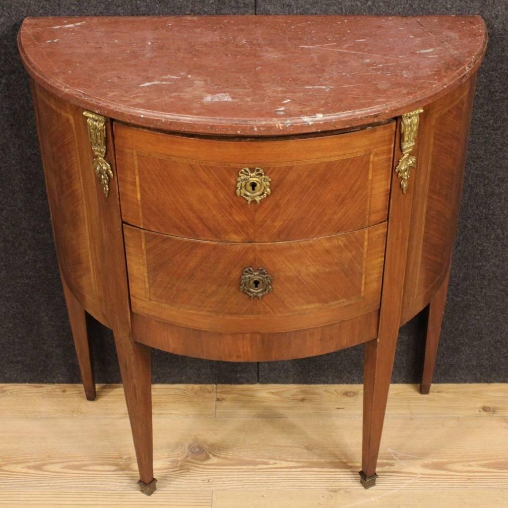 Small French demilune dresser of the mid-20th century. Furniture in Louis XVI style with two-drawers of good ability and service. Chest of drawers with original restored marble top. Furniture adorned with chiseled and gilded bronze. Dresser that can