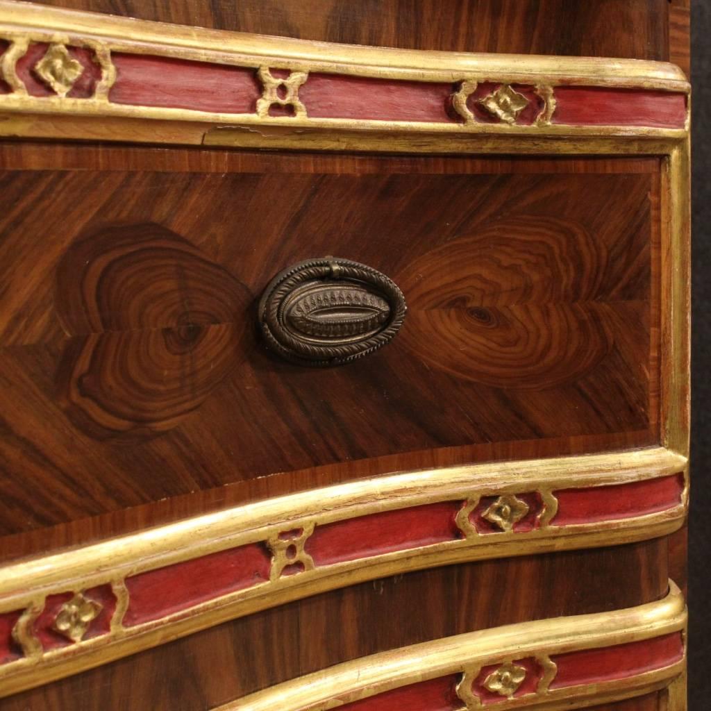 Genoese chest of drawers of the mid-20th century. Italian dresser finely inlaid in rosewood and palisander with carved, painted and gilded wooden frames. Furniture with three drawers, of large capacity and service complete with three working keys.