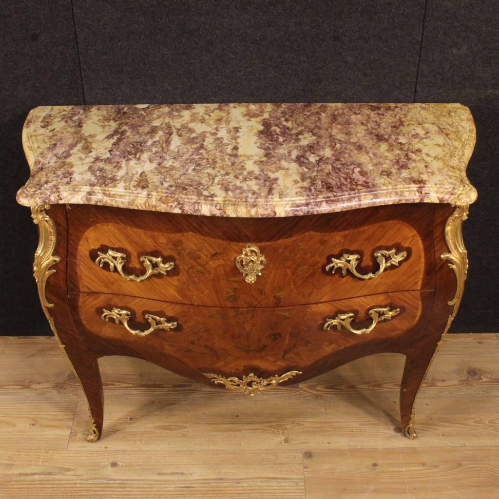 French dresser of the 20th century. Furniture in Louis XV style, richly inlaid in mahogany, rosewood and walnut with floral decorations. Top in original marble of great size and service, in perfect condition. Dresser delightfully adorned with