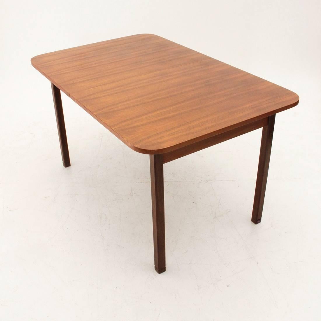 Table of Italian production of the 1960s.
Teak structure.
Teak veneered top with central extensions.
Width when extended 182 cm.
