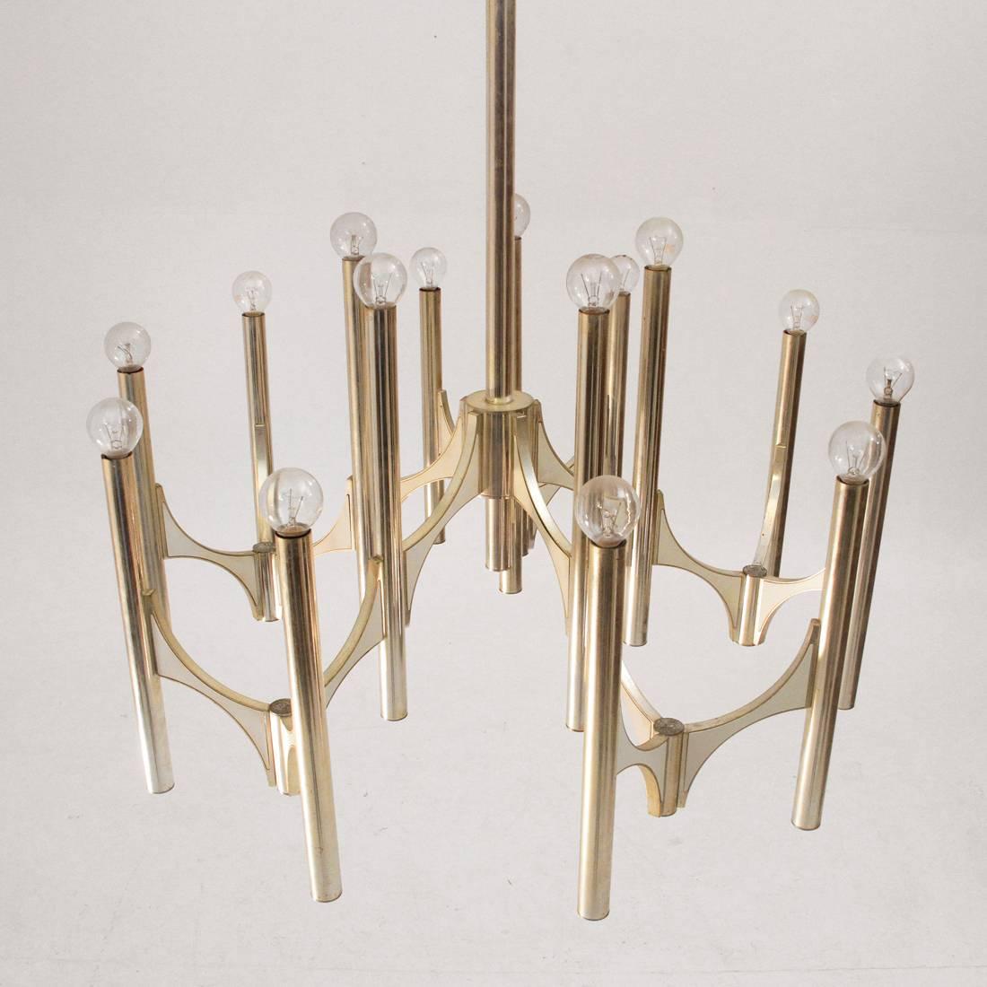 Magnificent chandelier produced by Sciolari in the 1970s.
Nickel-plated brass structure with white painted metal inserts.
Five arms that mount 15 lights.
Good general conditions, structure to be polished.
Dimensions: Diameter 80 cm, height 120