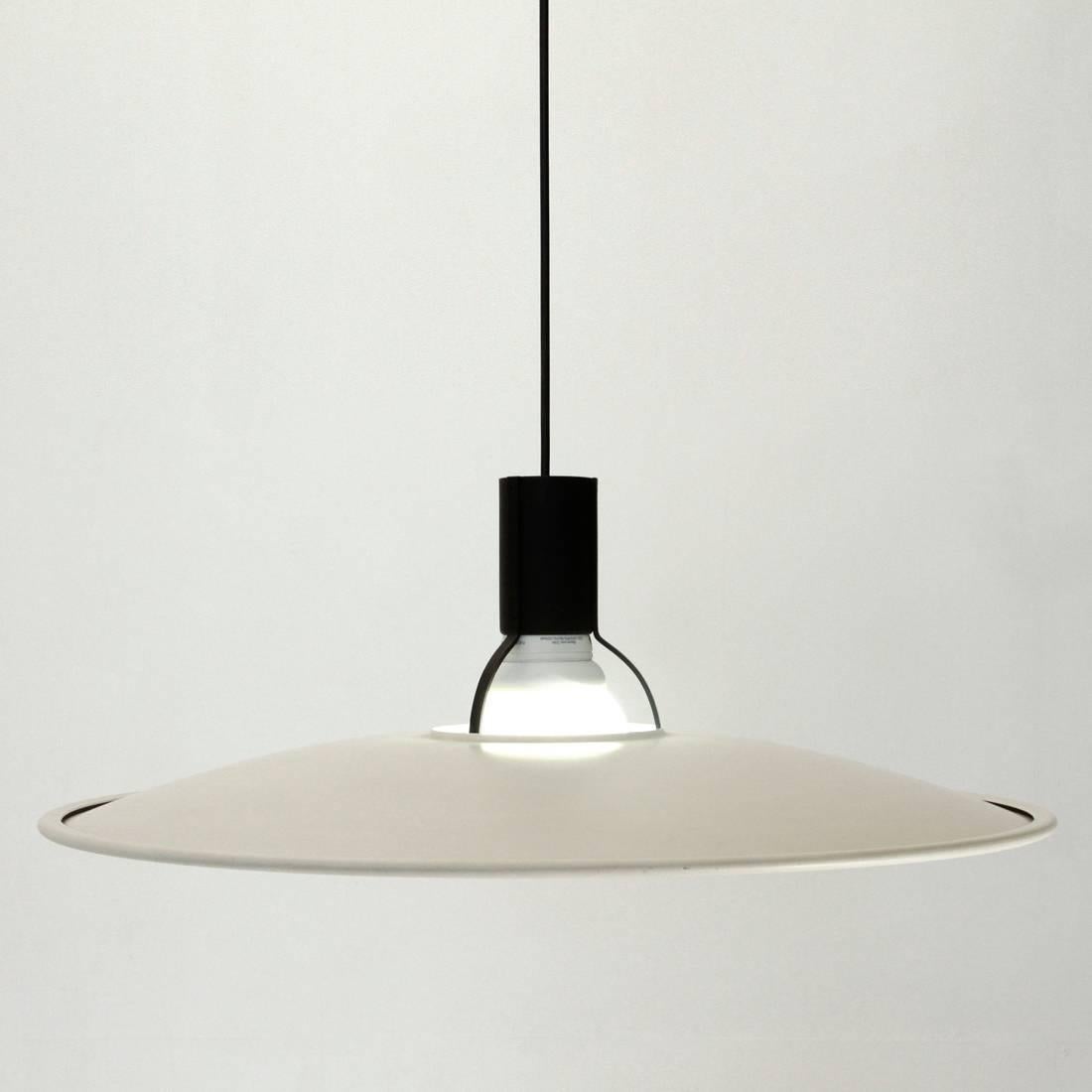 Ceiling lamp designed in 1973 by Gino Sarfatti for Arteluce.
Black metal frame, Circular white lacquered metal diffuser.
Some signs on the diffuser where the lamp holder is supported.
Dimensions: Diameter 62 cm, height 76 cm.