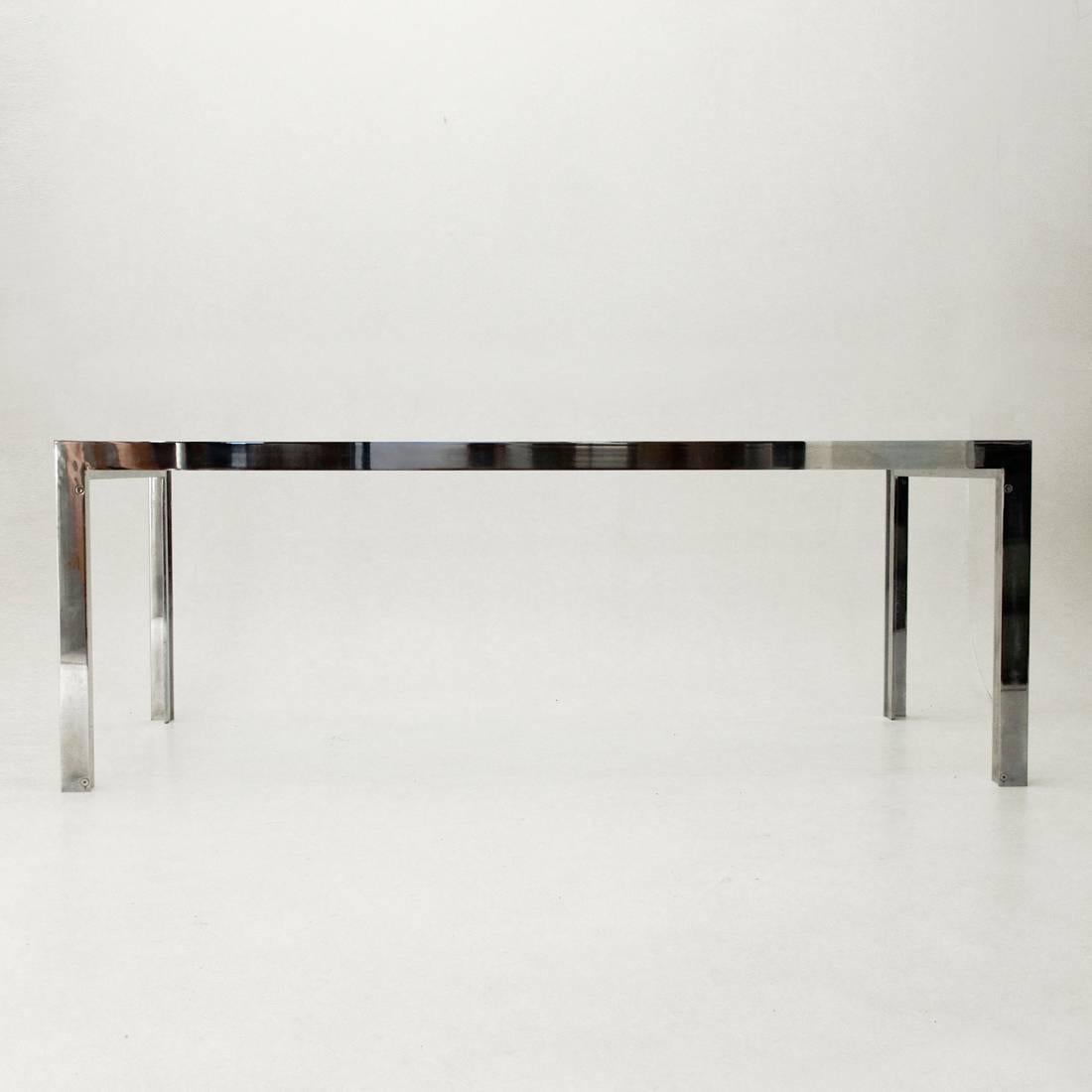 Impressive dining table produced in the 1970s.
Chromium-plated steel structure, high thickness of glass.
Good condition, small snap in a corner of the glass.
Dimensions: Width 200 cm, depth 102 cm, height 73 cm.