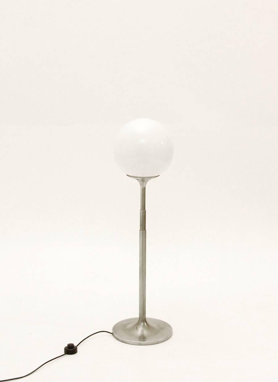 Polluce telescope floor lamp was designed in the early 1960s by Enzo Mari and Anna Fasolis and was produced in 1965 by Artemide in Italy. It is made from an aluminum frame with a round base and an extendable rod. There is a mark on the base, it has