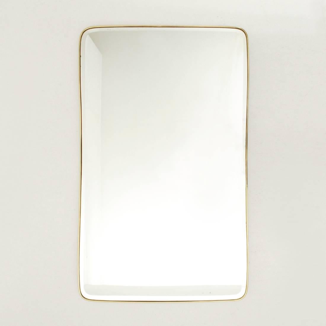 Italian mirror production of 1950s.
Wooden frame, mirrored glass with bevelled edges and brass frame.
Good general conditions, some film flaws on the mirror.

Dimensions: Width 65 cm - Depth 3 cm - Height 106 cm