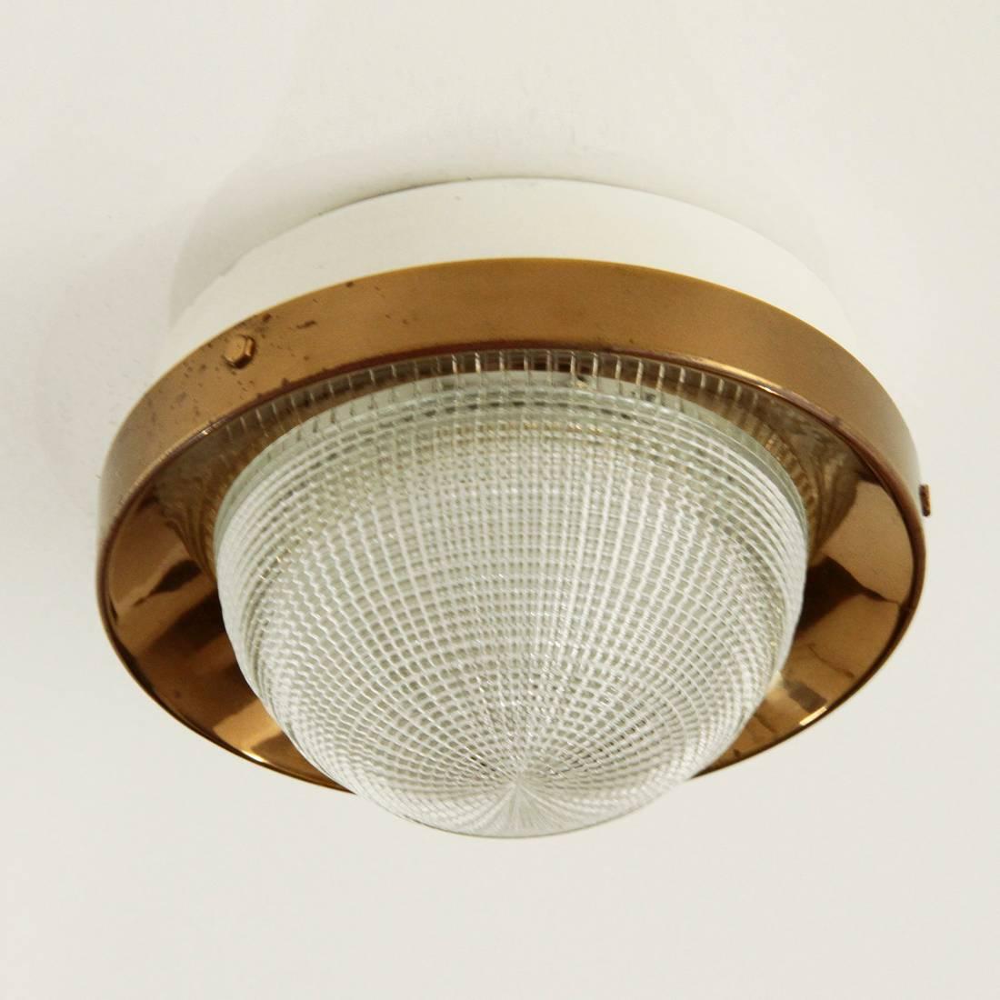 Wall lamp from the 1950s produced by Stilnovo.
Structure in white painted metal and brass
Glass diffuser.
Good general conditions, some signs on the structure.

Dimensions: Diameter 16 cm - Height 10 cm.