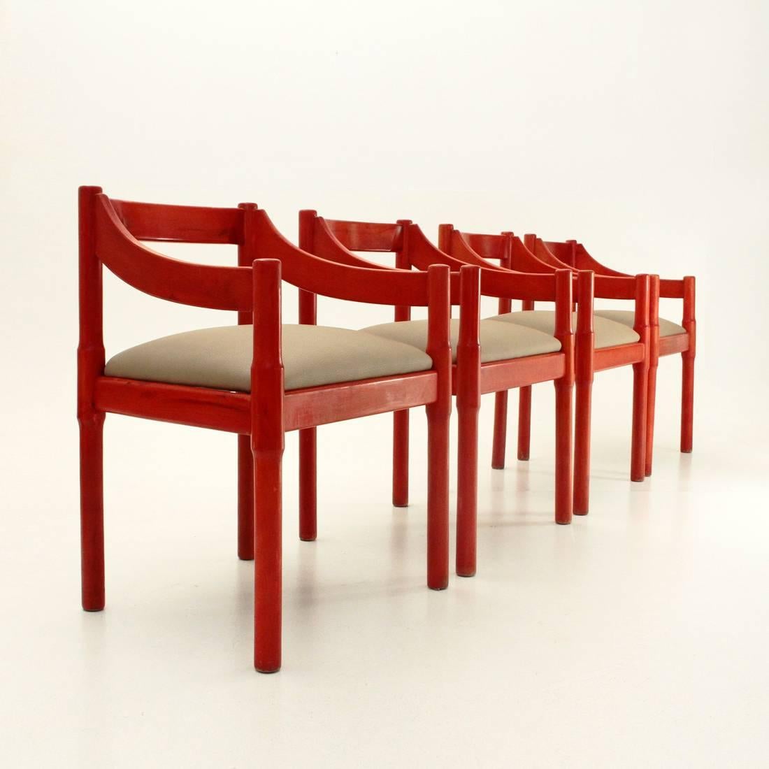 Four 1960s chairs initially designed by Vico Magistretti for the Carimate club near Milan, were then produced for the public by Cassina.
Red aniline dyed beechwood frame.
Seat padded and lined in faux beige leather.
Good general conditions, some