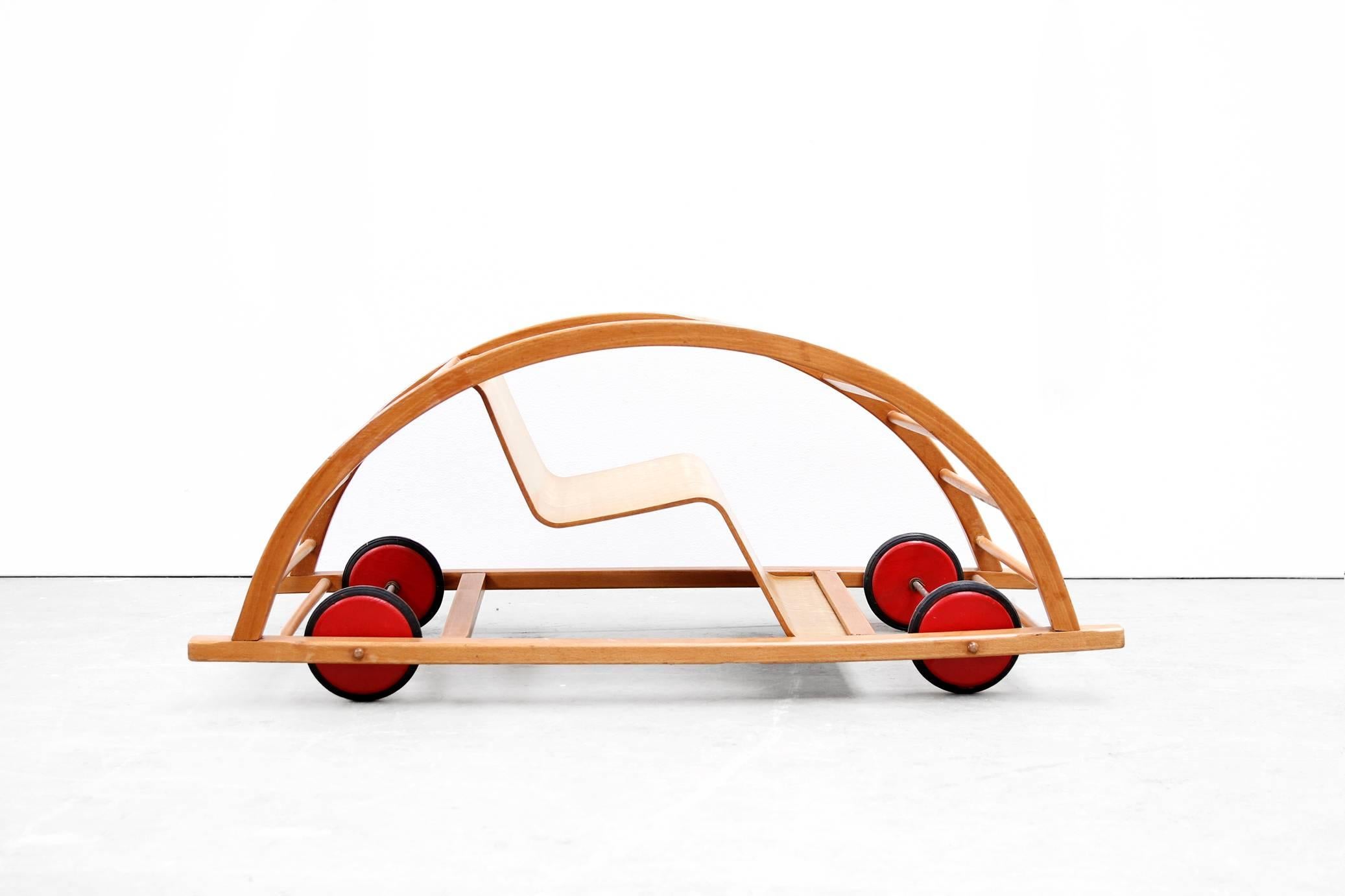 Very nice rocking chair, which can be used as a race car as you turn it. This fantastic design car for children is called Schaukelwagen and is designed by Hans Brockhage and Erwin Andra supervised by Mart Stam in Germany (DDR). In 1956 this swing