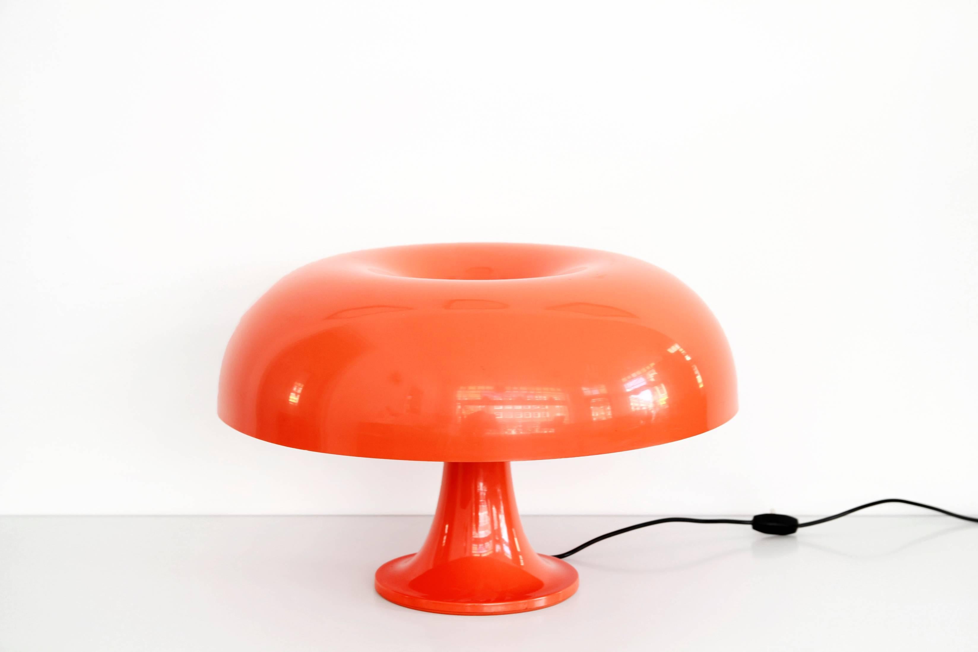 Magnificent mushroom lamp designed by Giancarlo Mattioli for Artemide, Italy. The Italian design lamp is made of orange plastic. The lamp has four E14 fittings, which ensures that the lamp can give off plenty of light. 
This lamp is a real
