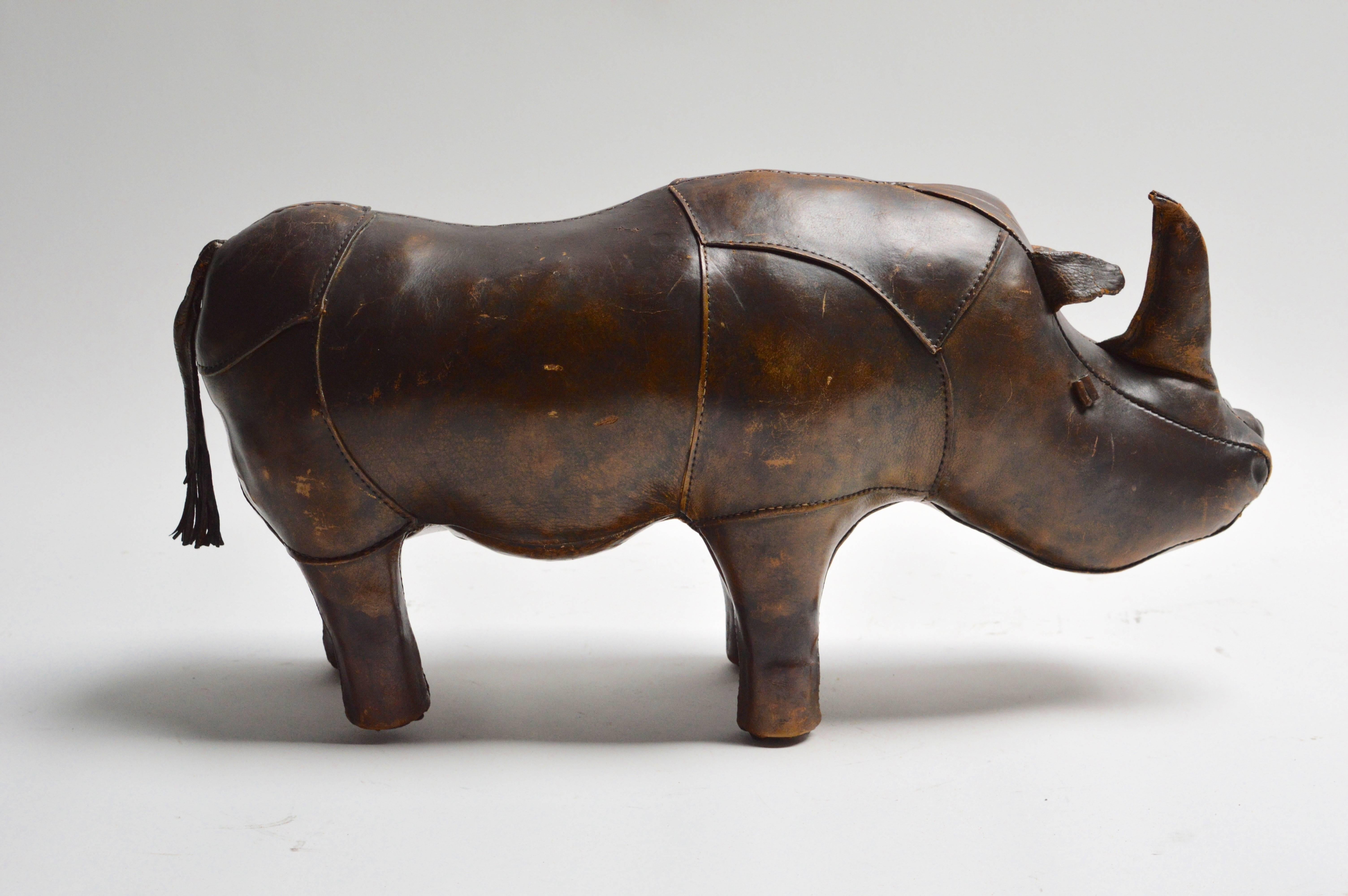 Handsome leather rhinoceros by Omersa. Very sturdy stool or footstool. Also a great sculptural object. Beautiful age and patina to brown leather. Excellent vintage condition.