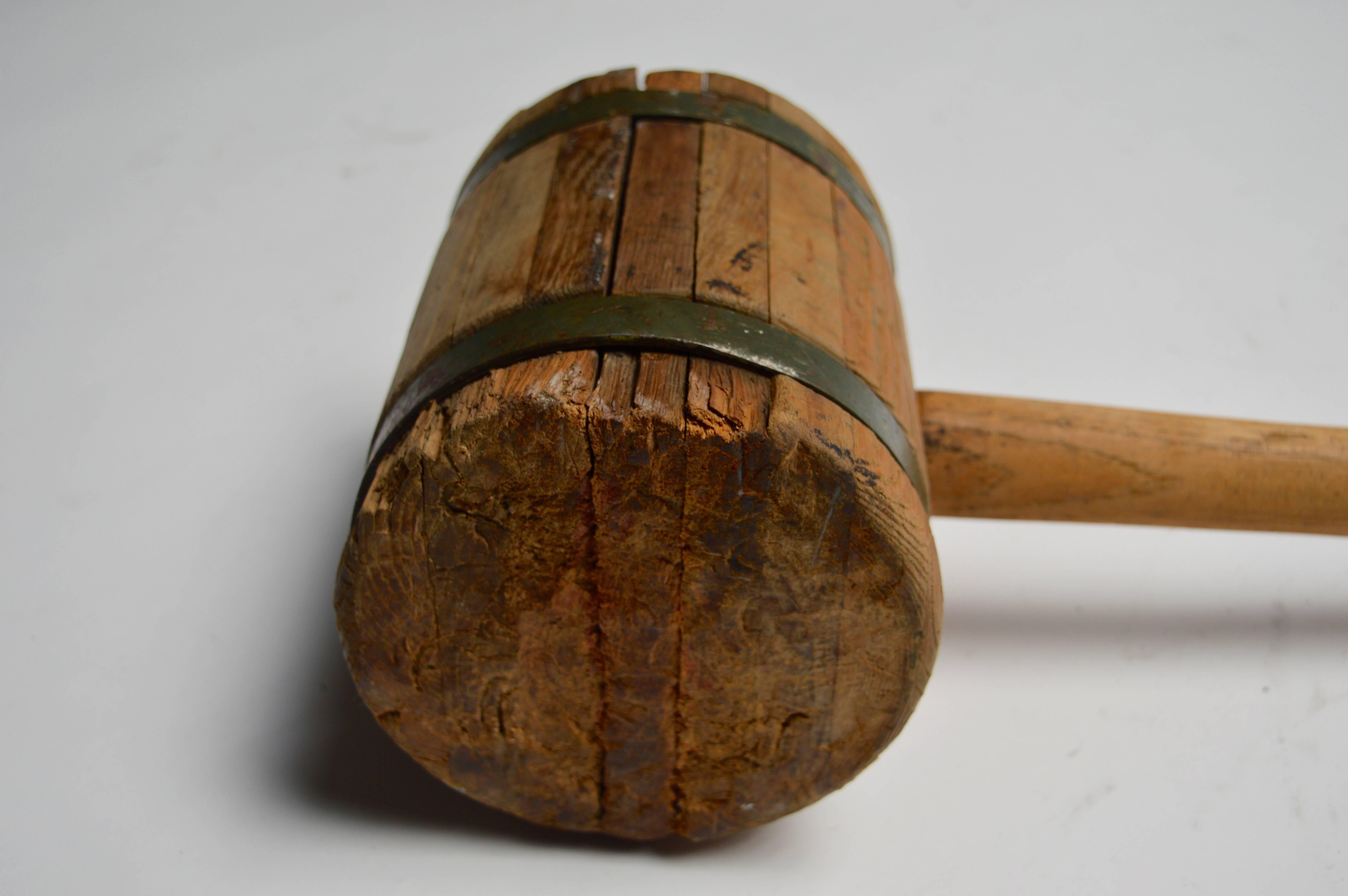 Massive circus mallet. Wood and brass mallet used for driving in large stakes for the circus tents. Great piece of Americana. Good vintage condition. Some faint writing throughout. Awesome sculpture and object.