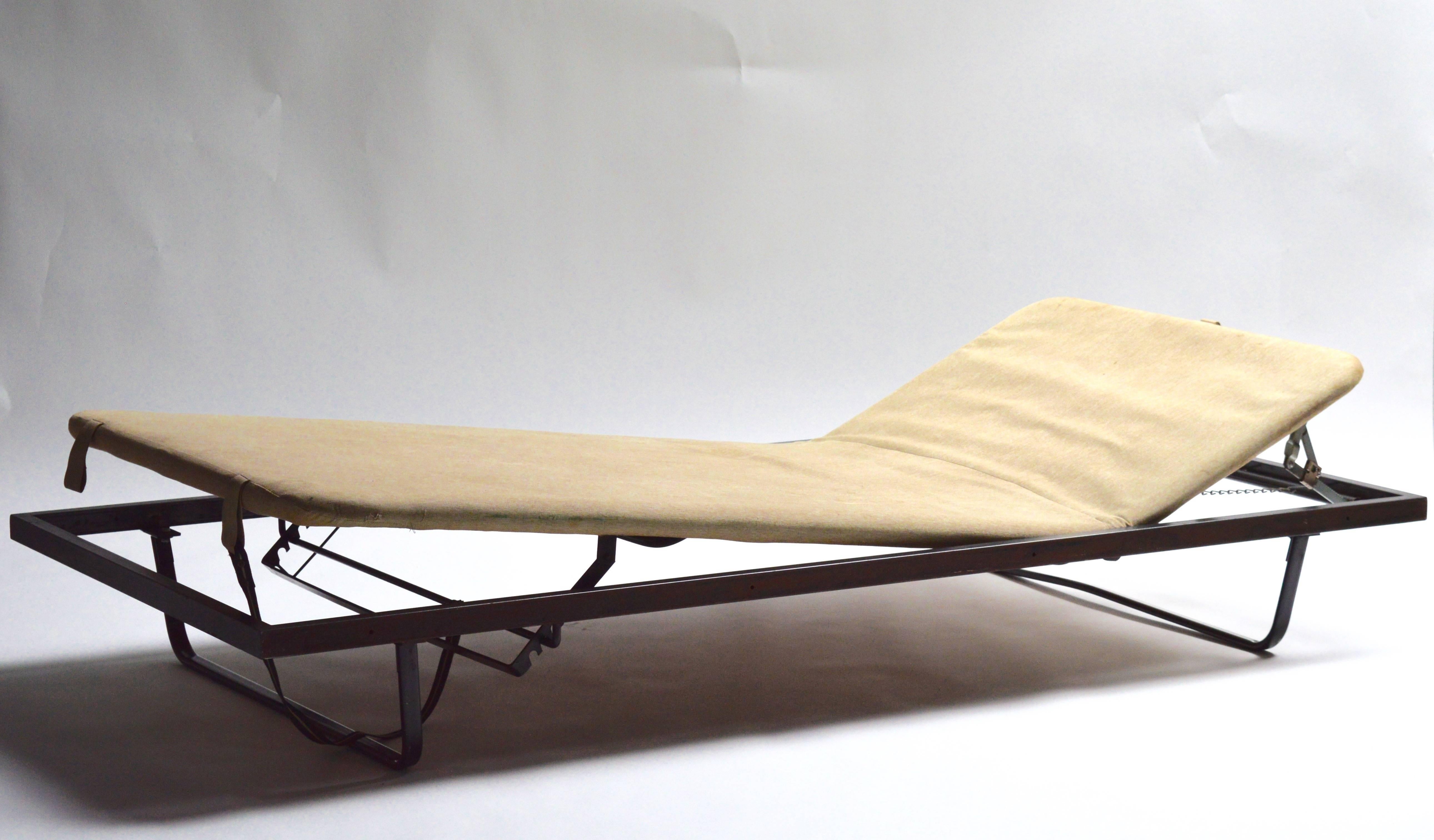 Sleek Industrial German military daybed. Both ends are adjustable up and down. Newly upholstered. Modern design and great lines. Iron frame with spring backed cushion. Excellent vintage condition.