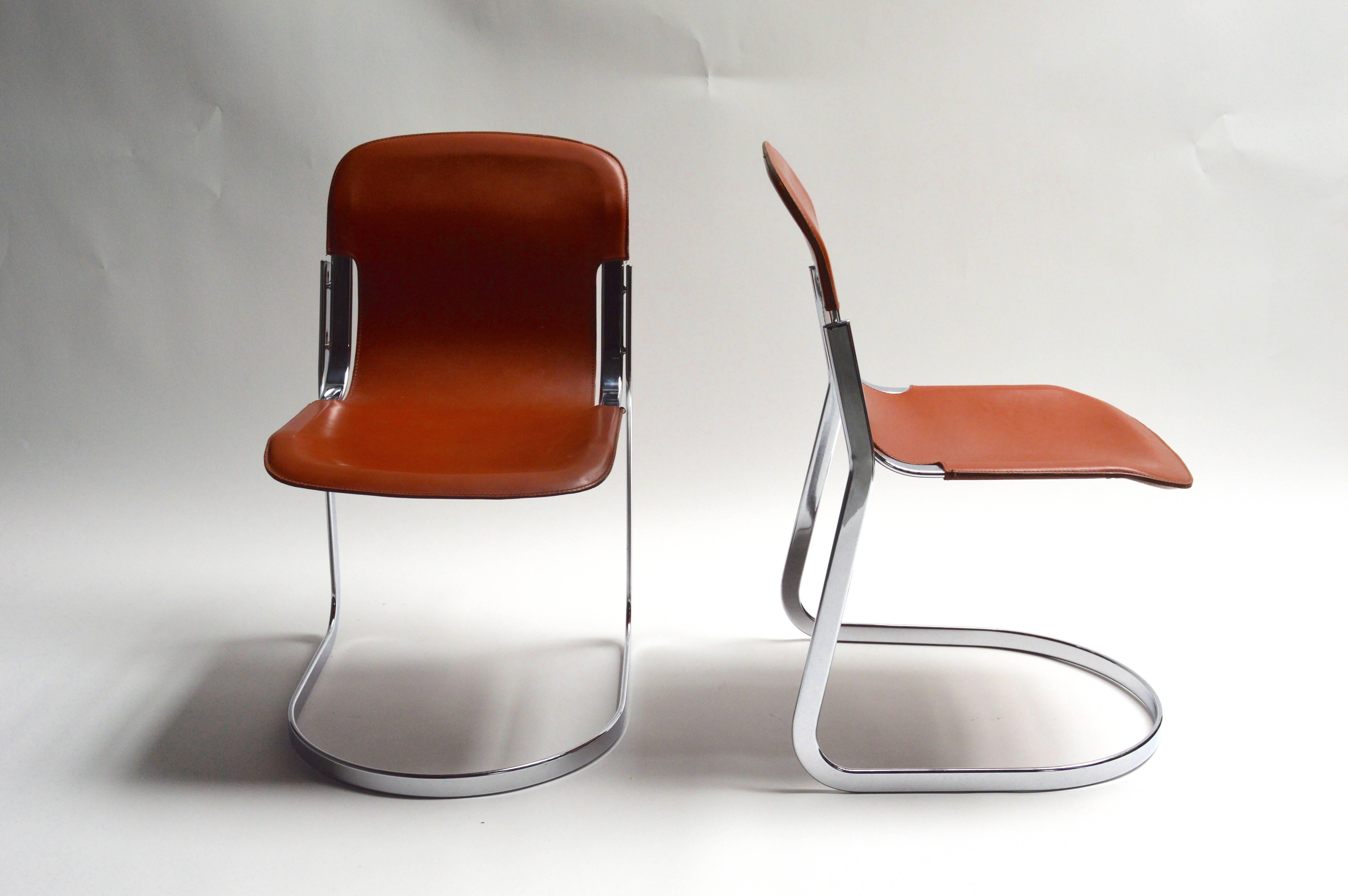 Handsome set of Italian steel and saddle leather sling chairs. Designed by Willy Rizzo. Made in Italy tag underneath. Great vintage condition. Sold as a set of 4.