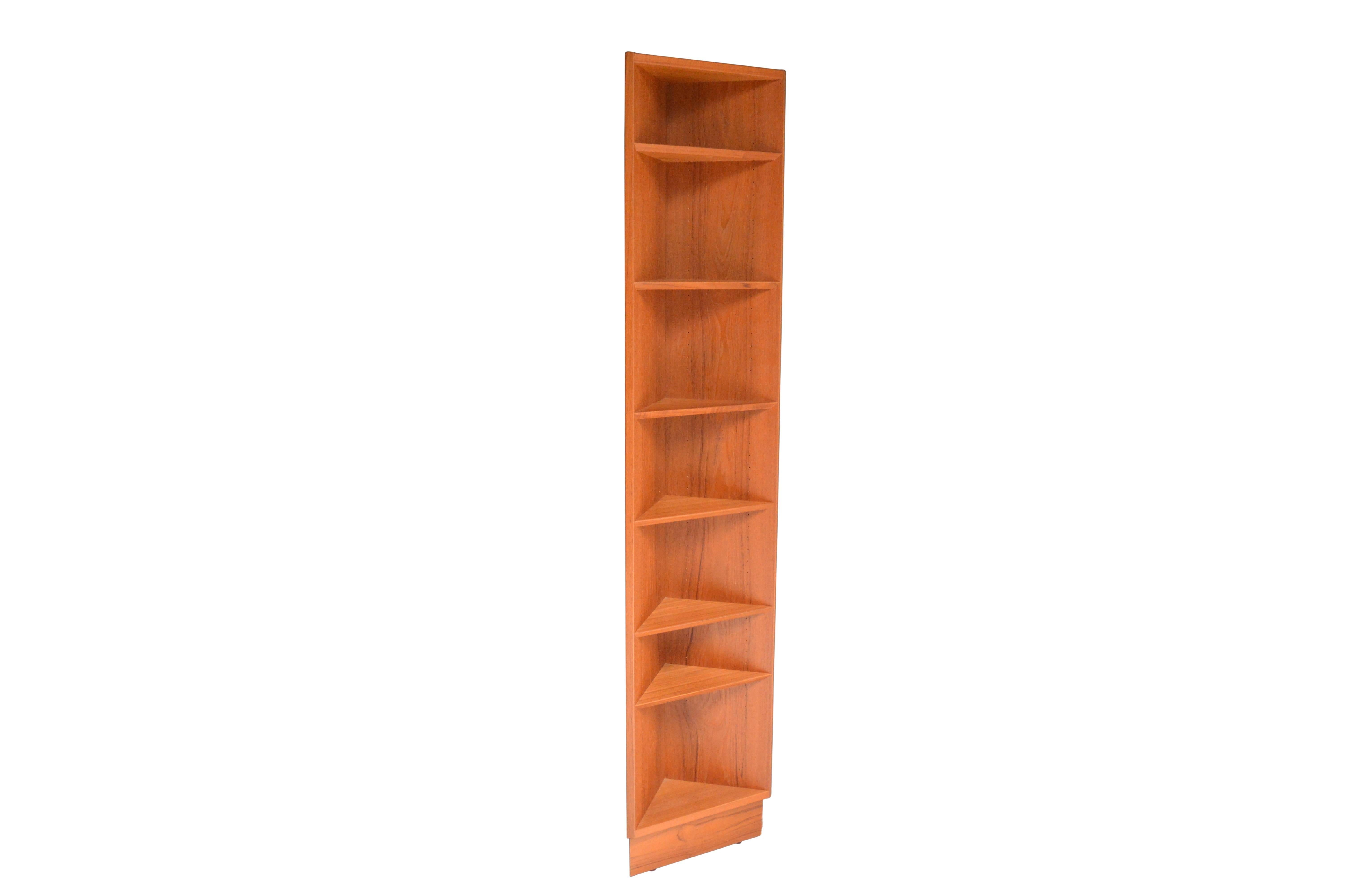 Useful pair of German corner shelves made of teak. Fits snug into the corner with a two inch 